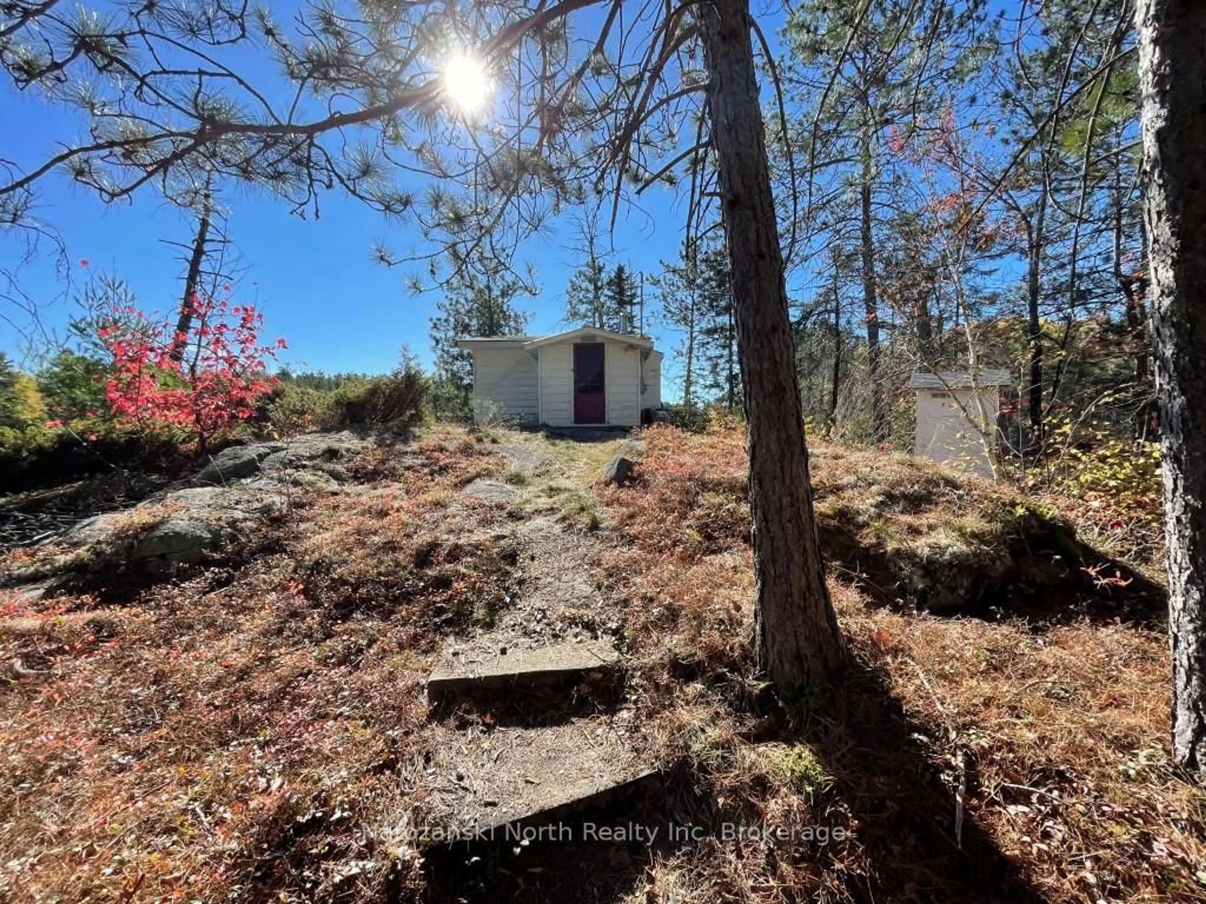 A pic from outside/outdoor area/front of a property/back of a property/a pic from drone, forest/trees view for 1096 East Rd, West Nipissing Ontario K6H 5R5