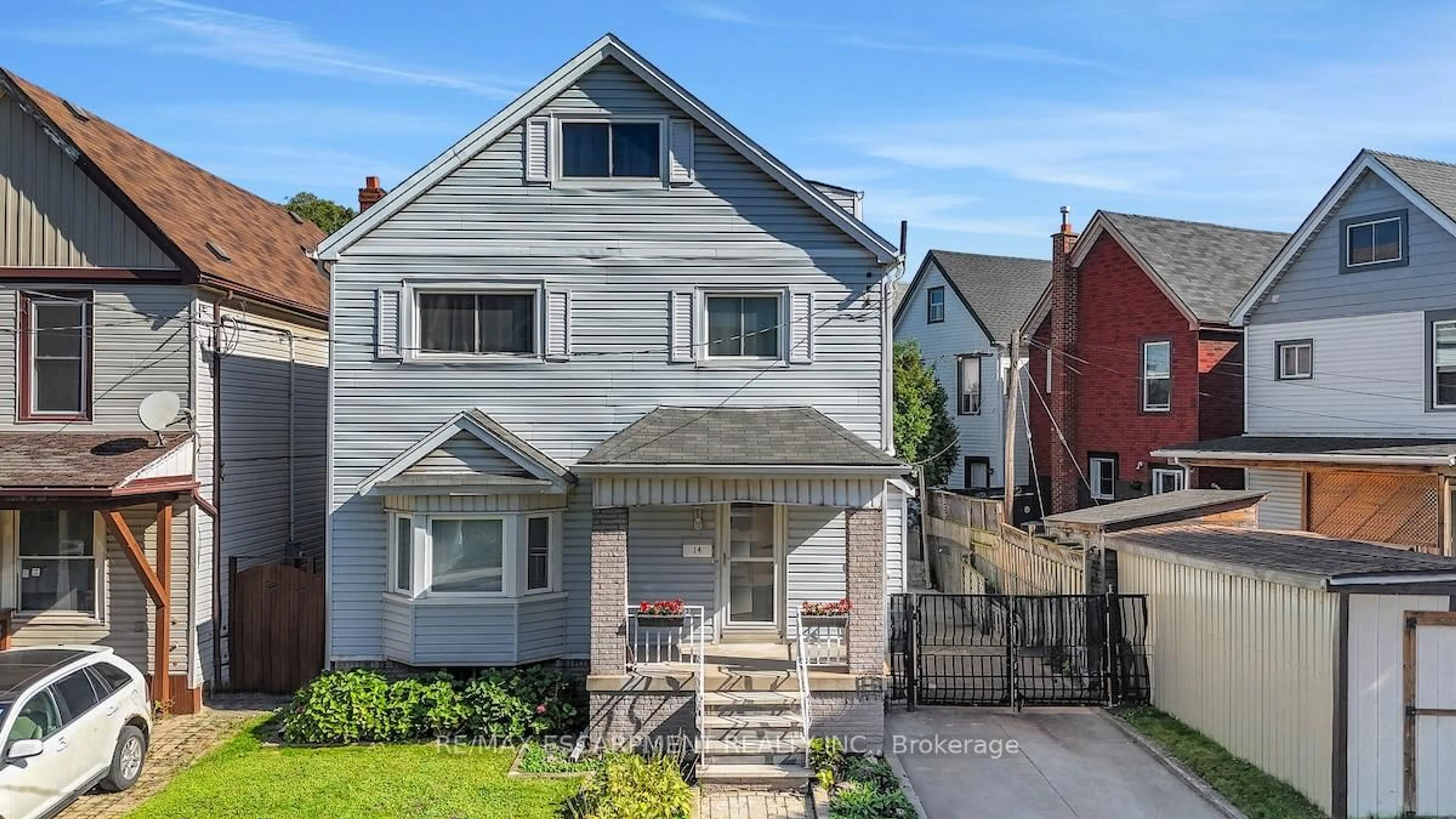 Home with vinyl exterior material, street for 14 Niagara St, Hamilton Ontario L8L 6A2