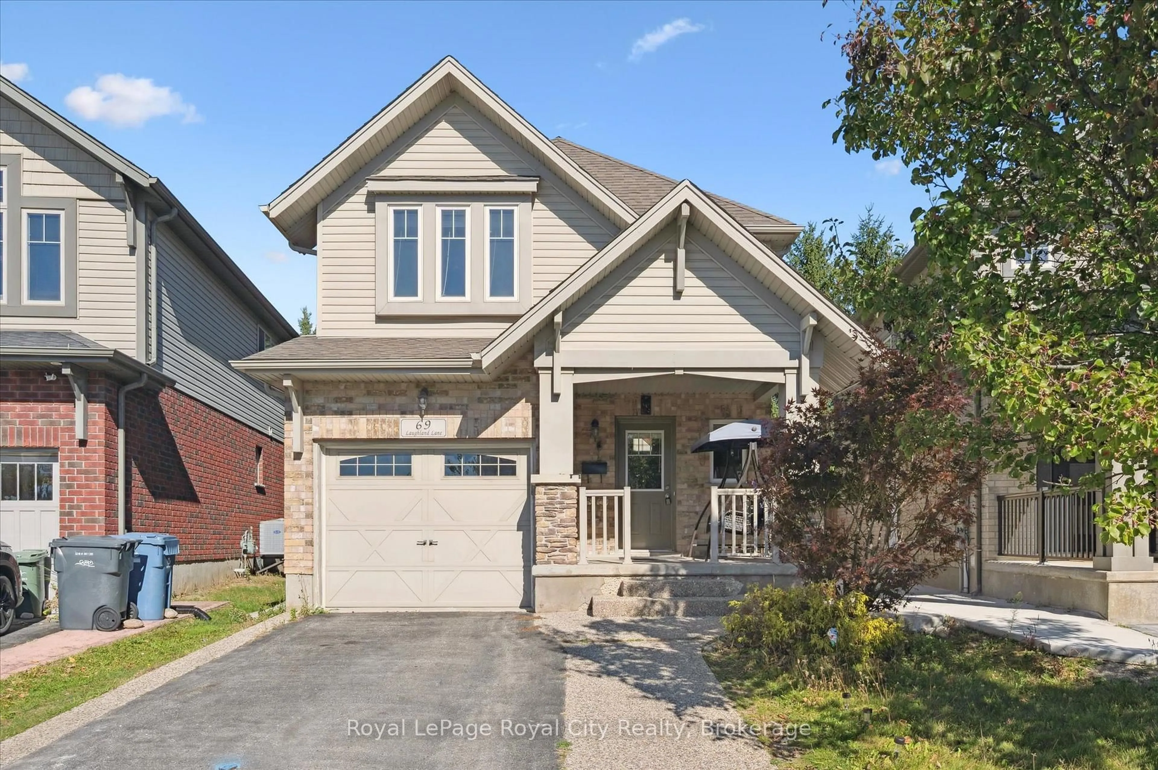 Home with brick exterior material, street for 69 Laughland Lane, Guelph Ontario N1L 0C6