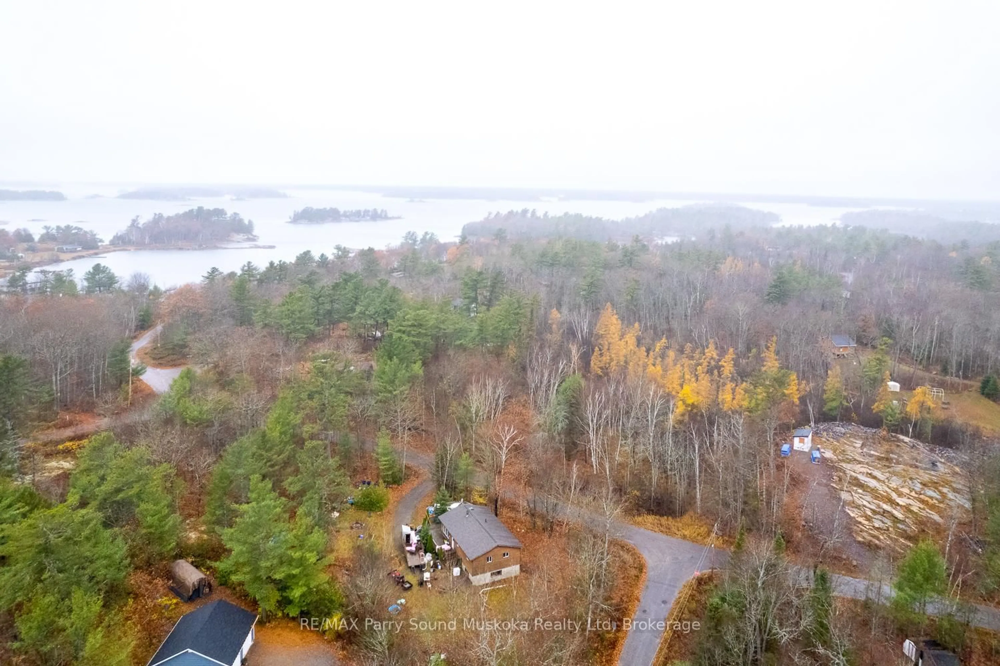A pic from outside/outdoor area/front of a property/back of a property/a pic from drone, water/lake/river/ocean view for 591 Skerryvore Community Rd, The Archipelago Ontario P0G 1G0