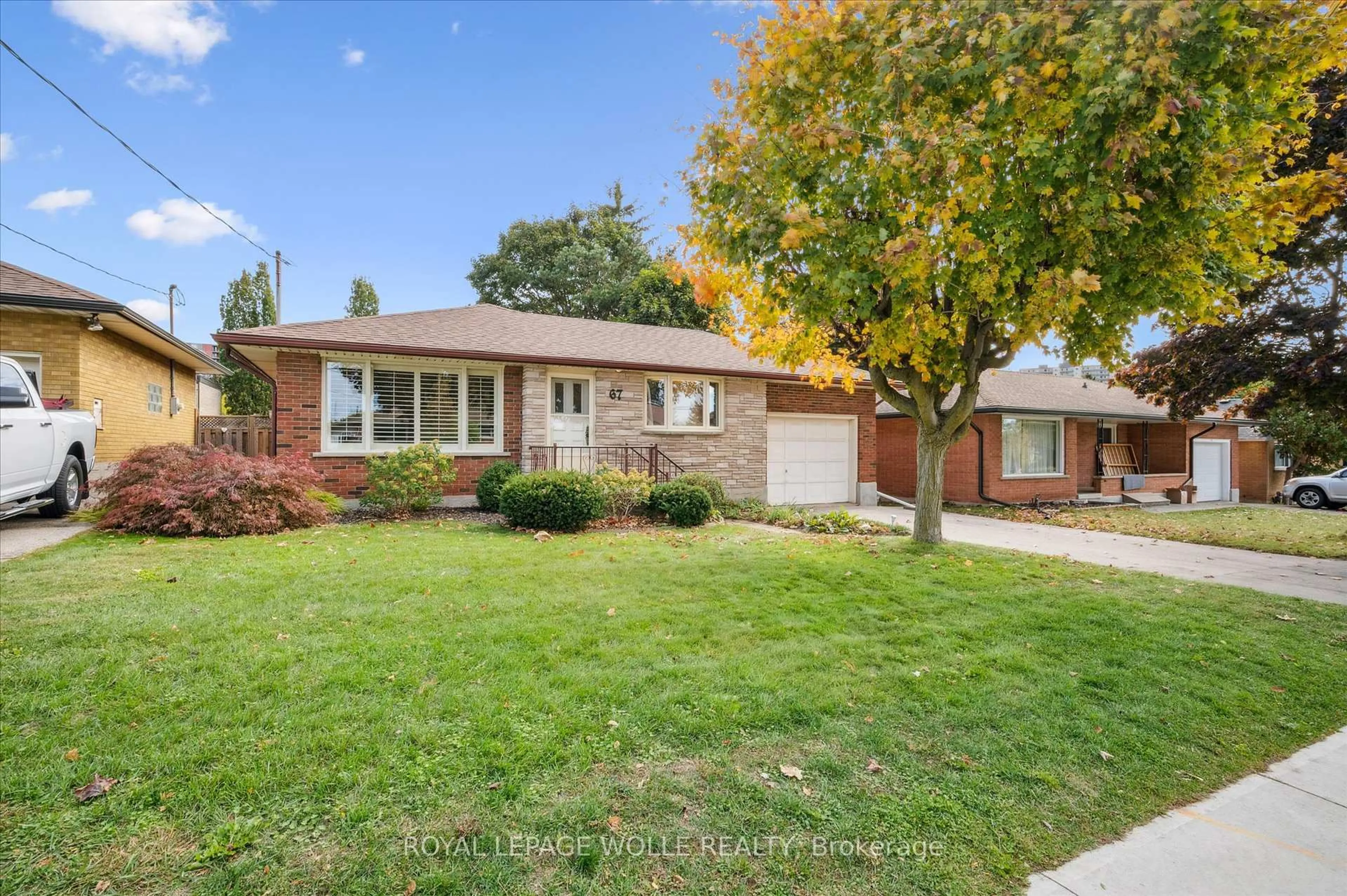 Home with brick exterior material, street for 67 Traynor Ave, Kitchener Ontario N2C 1W1