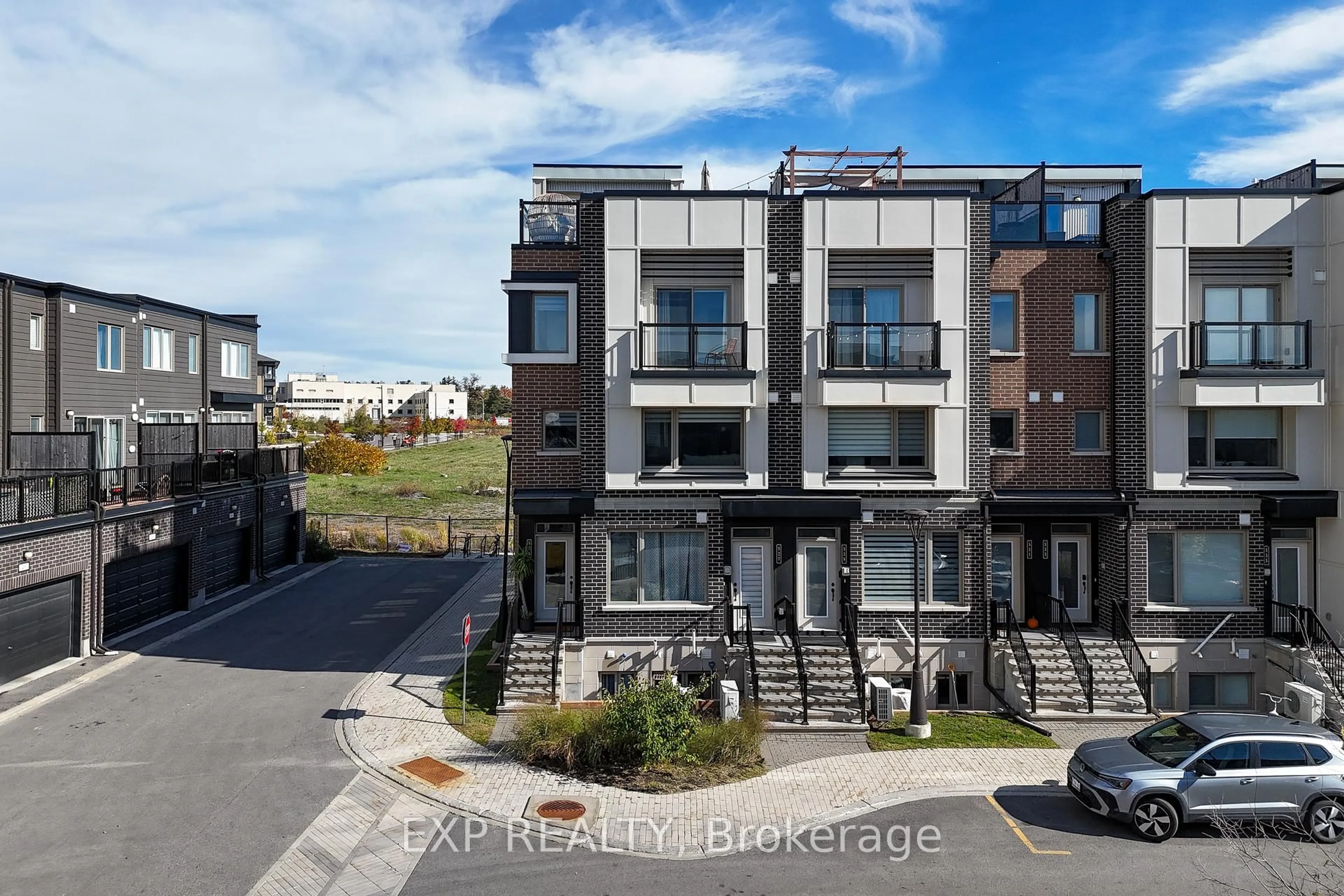 A pic from outside/outdoor area/front of a property/back of a property/a pic from drone, street for 525 Ozawa Private, Ottawa Ontario K1K 4Z8