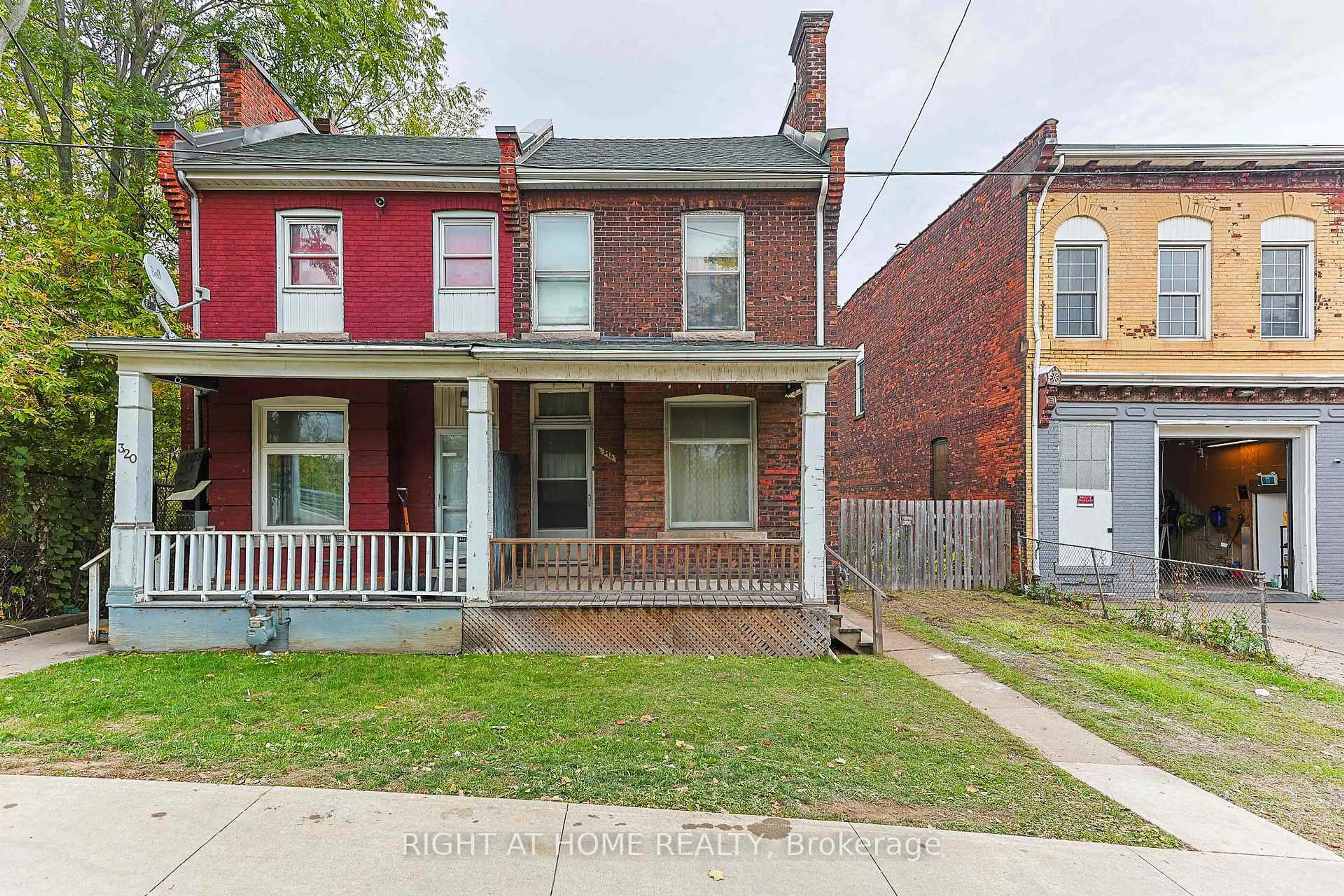 Home with brick exterior material, street for 318 John St, Hamilton Ontario L8L 4P9