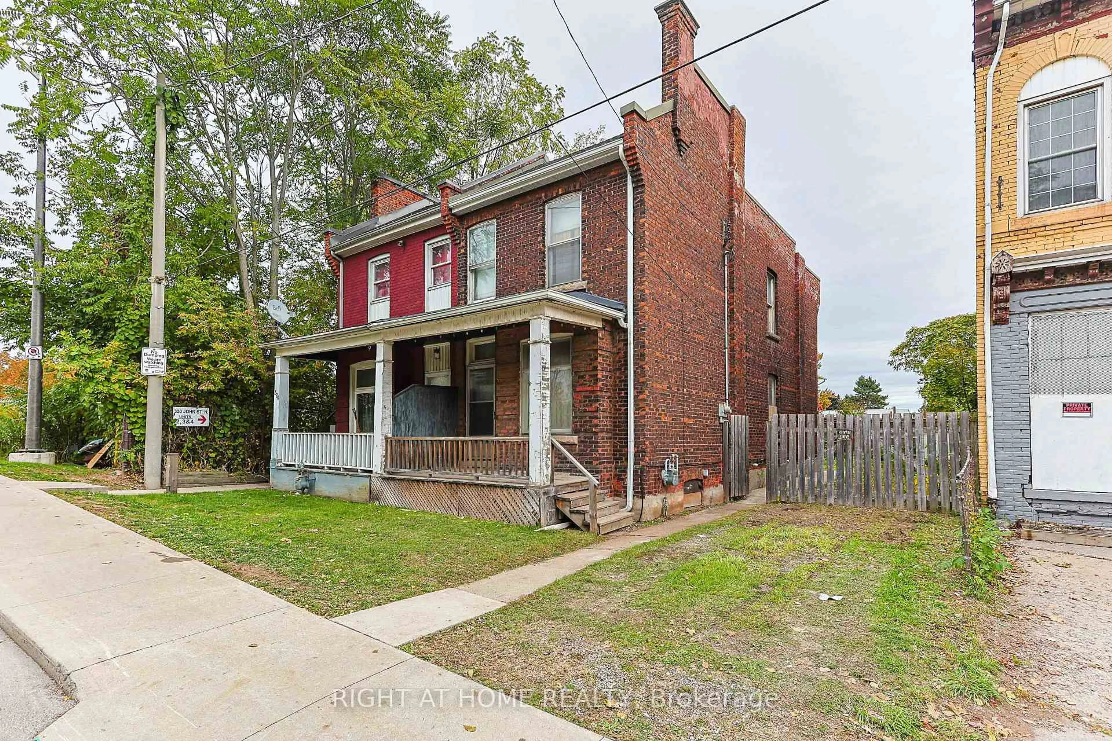 Home with brick exterior material, street for 318 John St, Hamilton Ontario L8L 4P9
