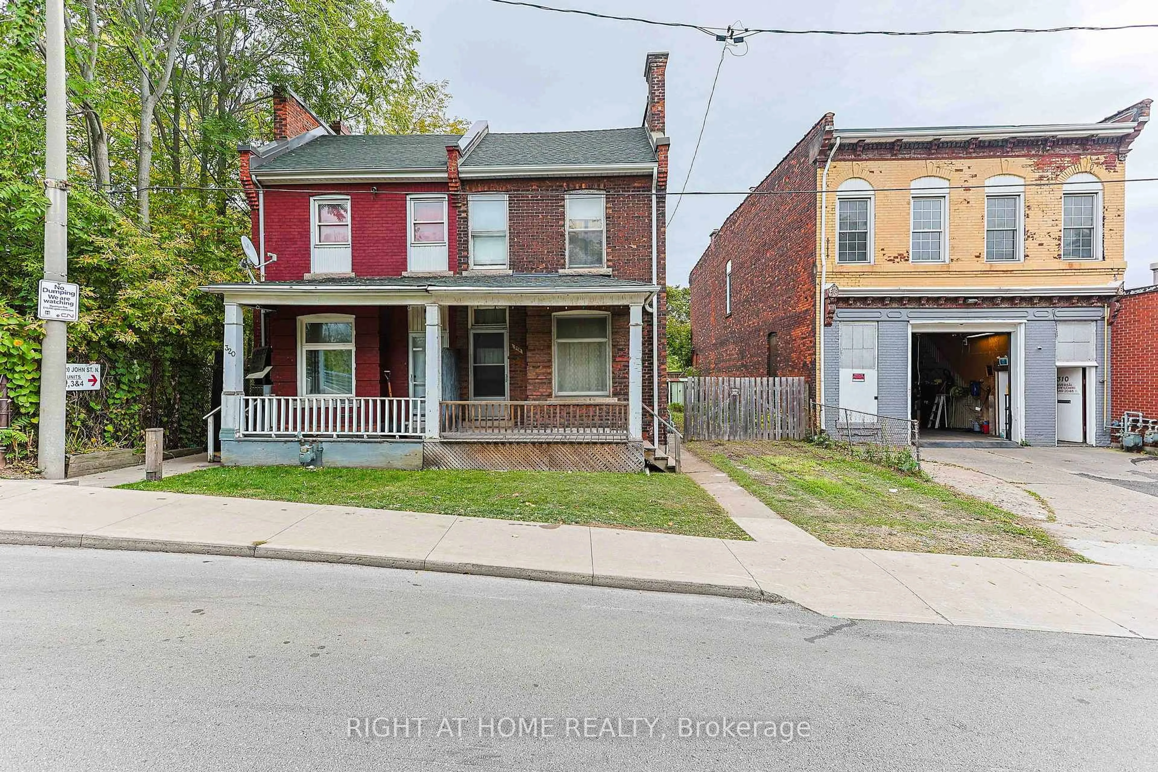 Home with brick exterior material, street for 318 John St, Hamilton Ontario L8L 4P9