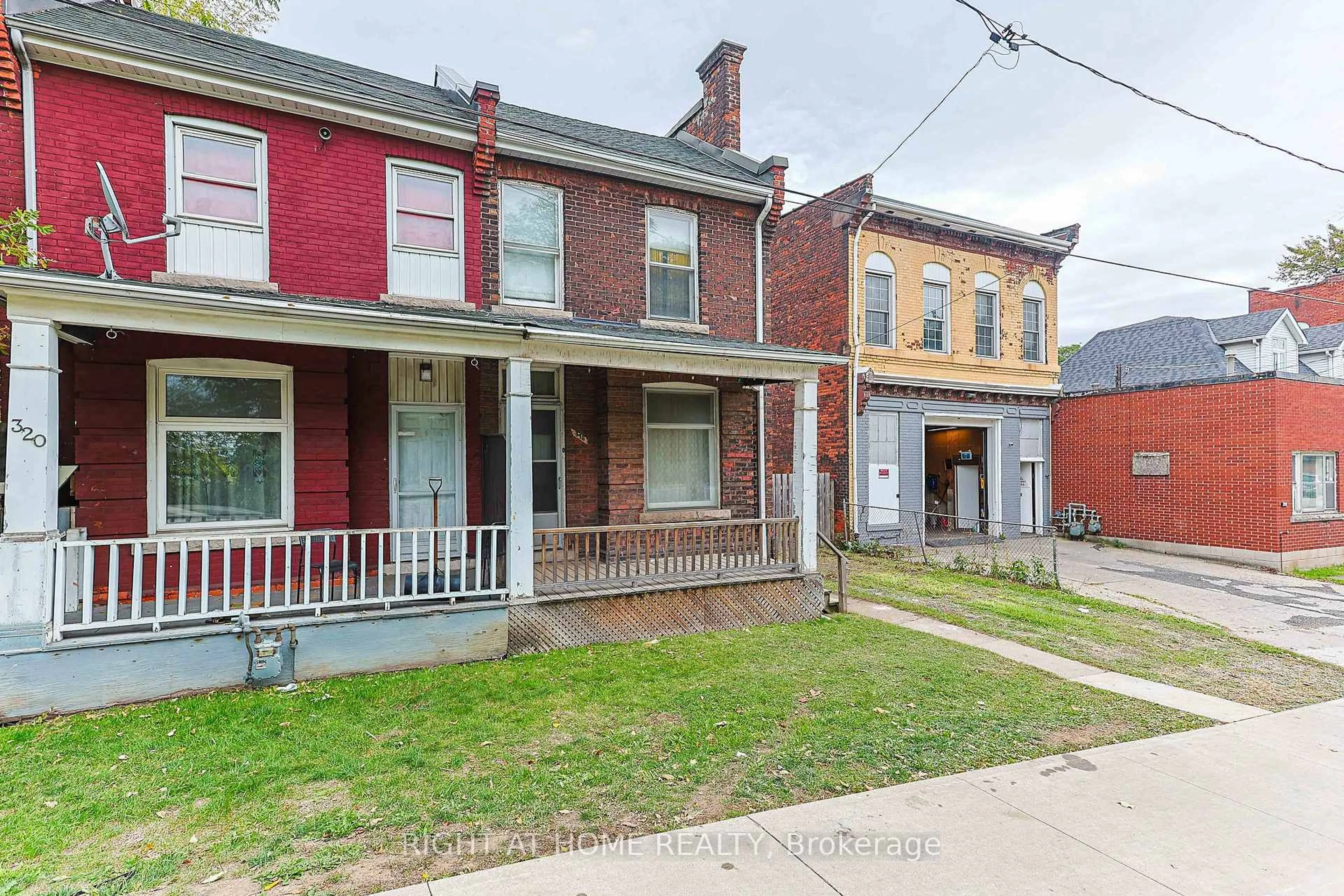 Home with brick exterior material, street for 318 John St, Hamilton Ontario L8L 4P9