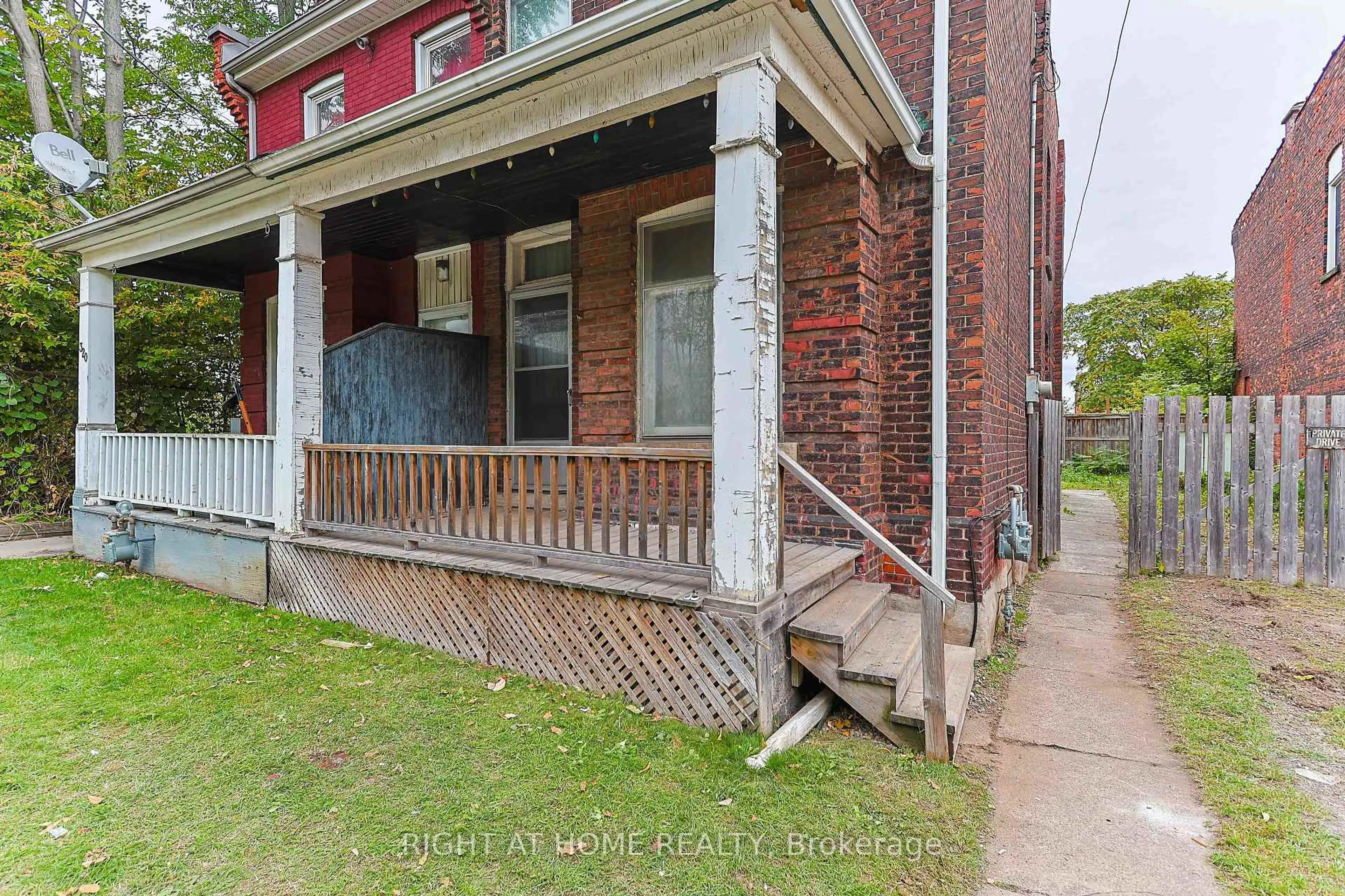 Home with brick exterior material, street for 318 John St, Hamilton Ontario L8L 4P9