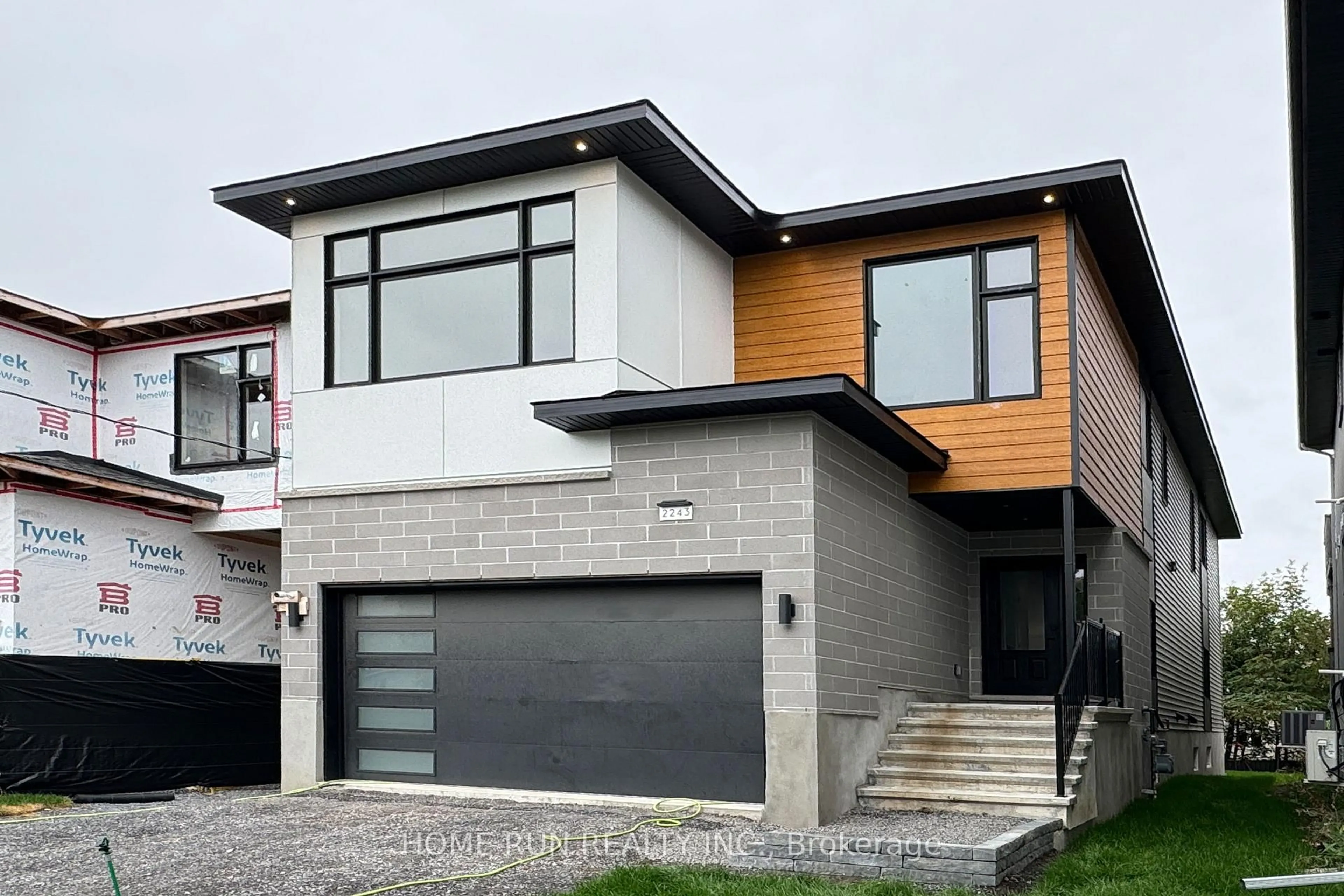 Home with brick exterior material, street for 2239 Page Rd, Orleans Ontario K1C 7K5