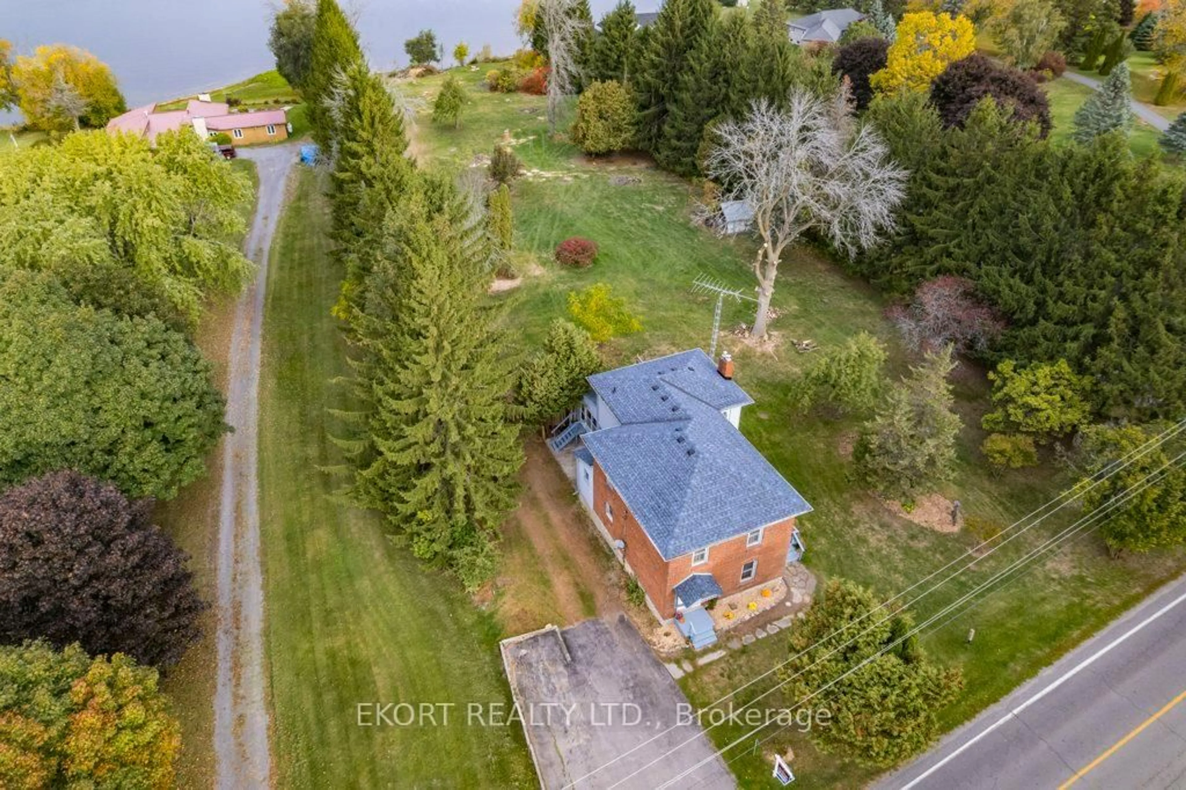 A pic from outside/outdoor area/front of a property/back of a property/a pic from drone, water/lake/river/ocean view for 2422 County Rd 3 Rd, Prince Edward County Ontario K0K 1L0