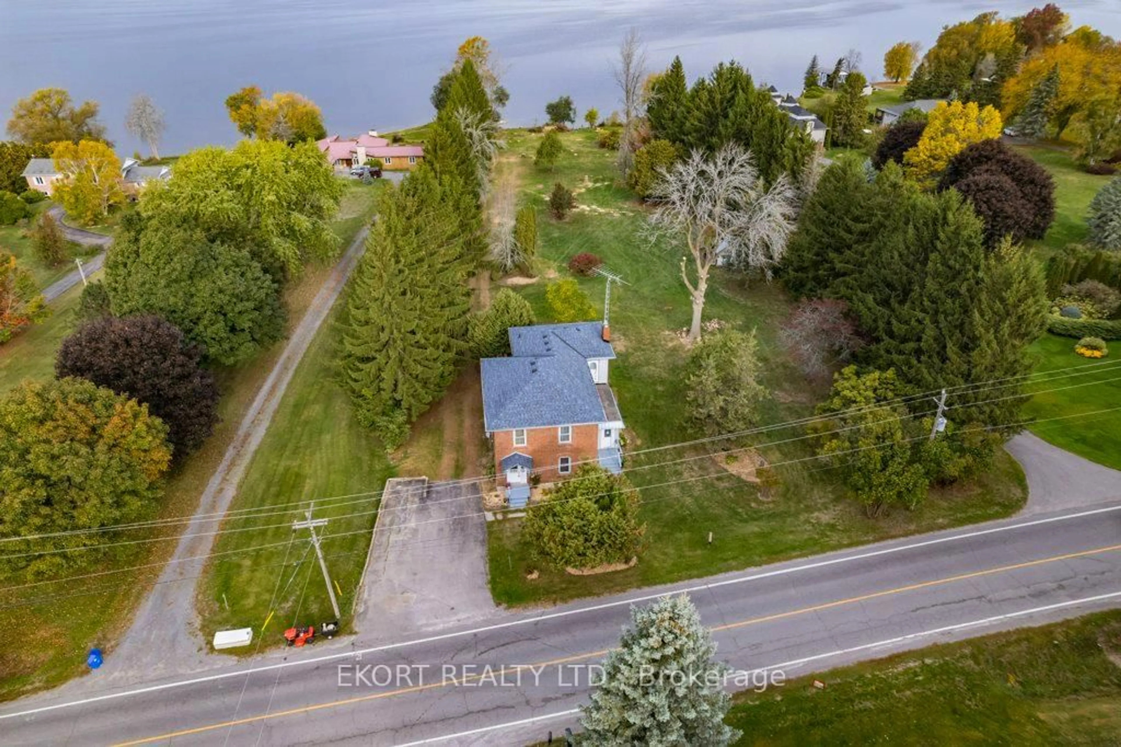 A pic from outside/outdoor area/front of a property/back of a property/a pic from drone, street for 2422 County Rd 3 Rd, Prince Edward County Ontario K0K 1L0