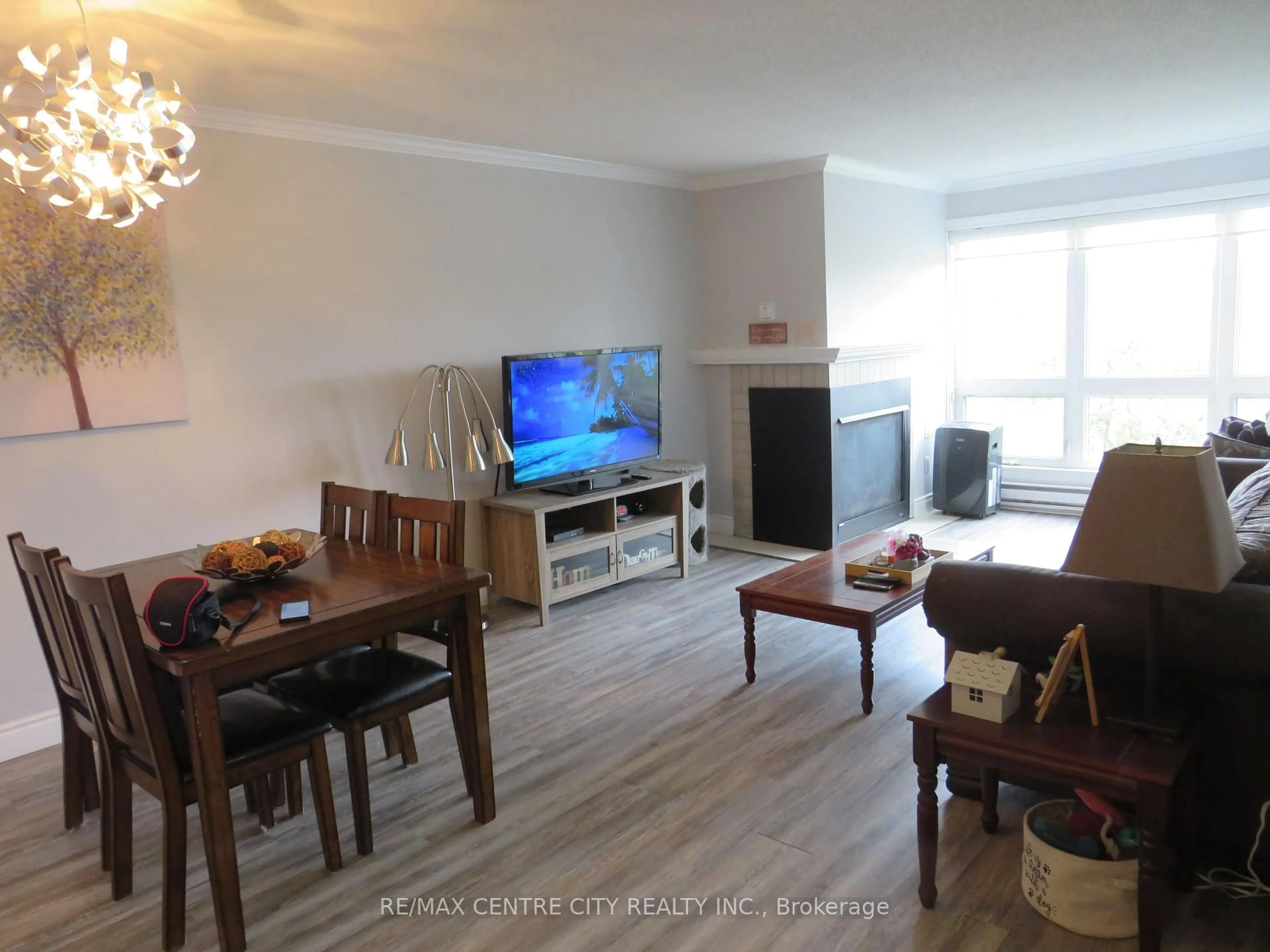 Living room with furniture, wood/laminate floor for 15 Jacksway Cres #402, London North Ontario N5X 3T8