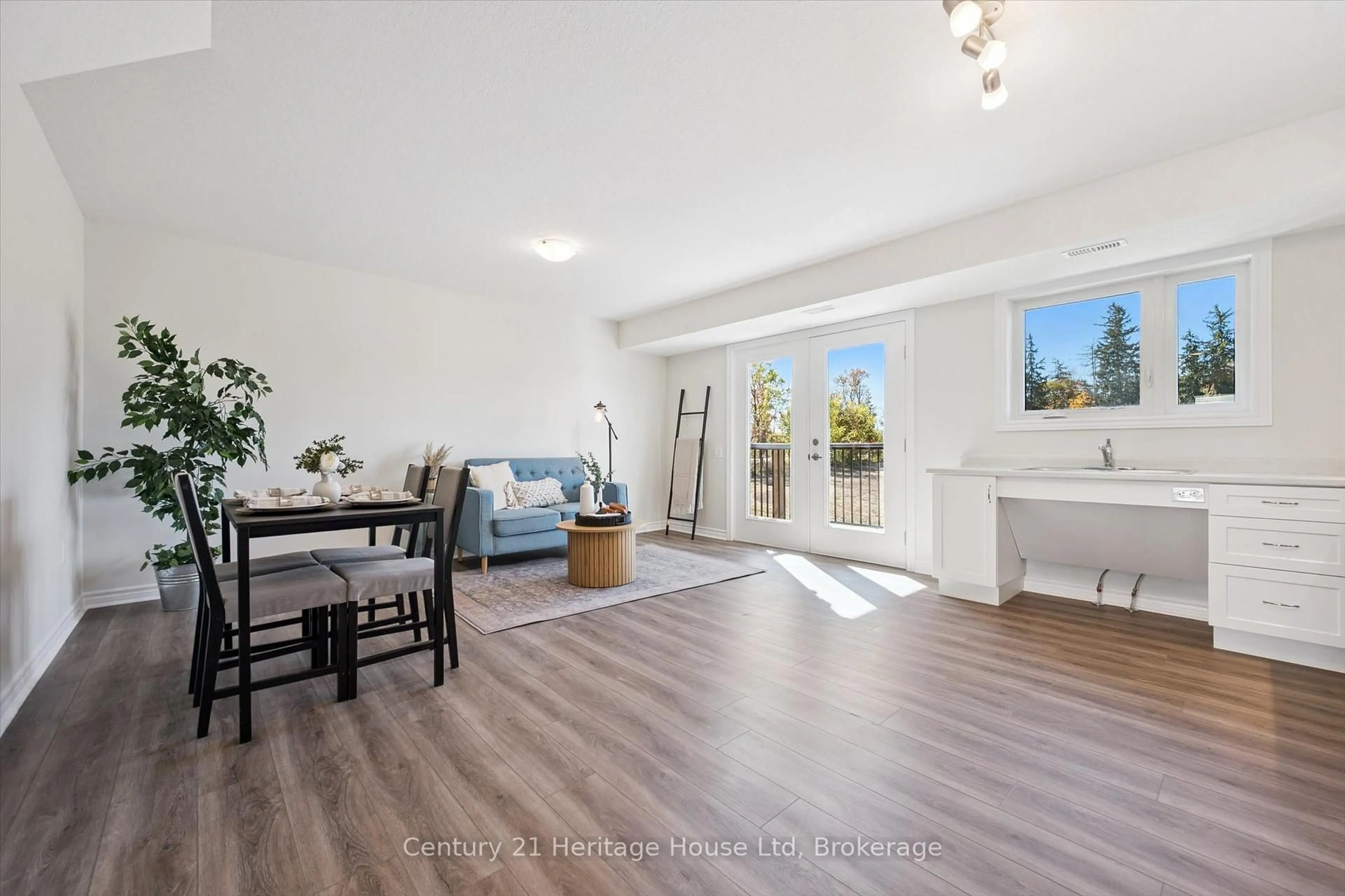 Living room with furniture, wood/laminate floor for 465 Garafraxa St #5, Centre Wellington Ontario N1M 0L6