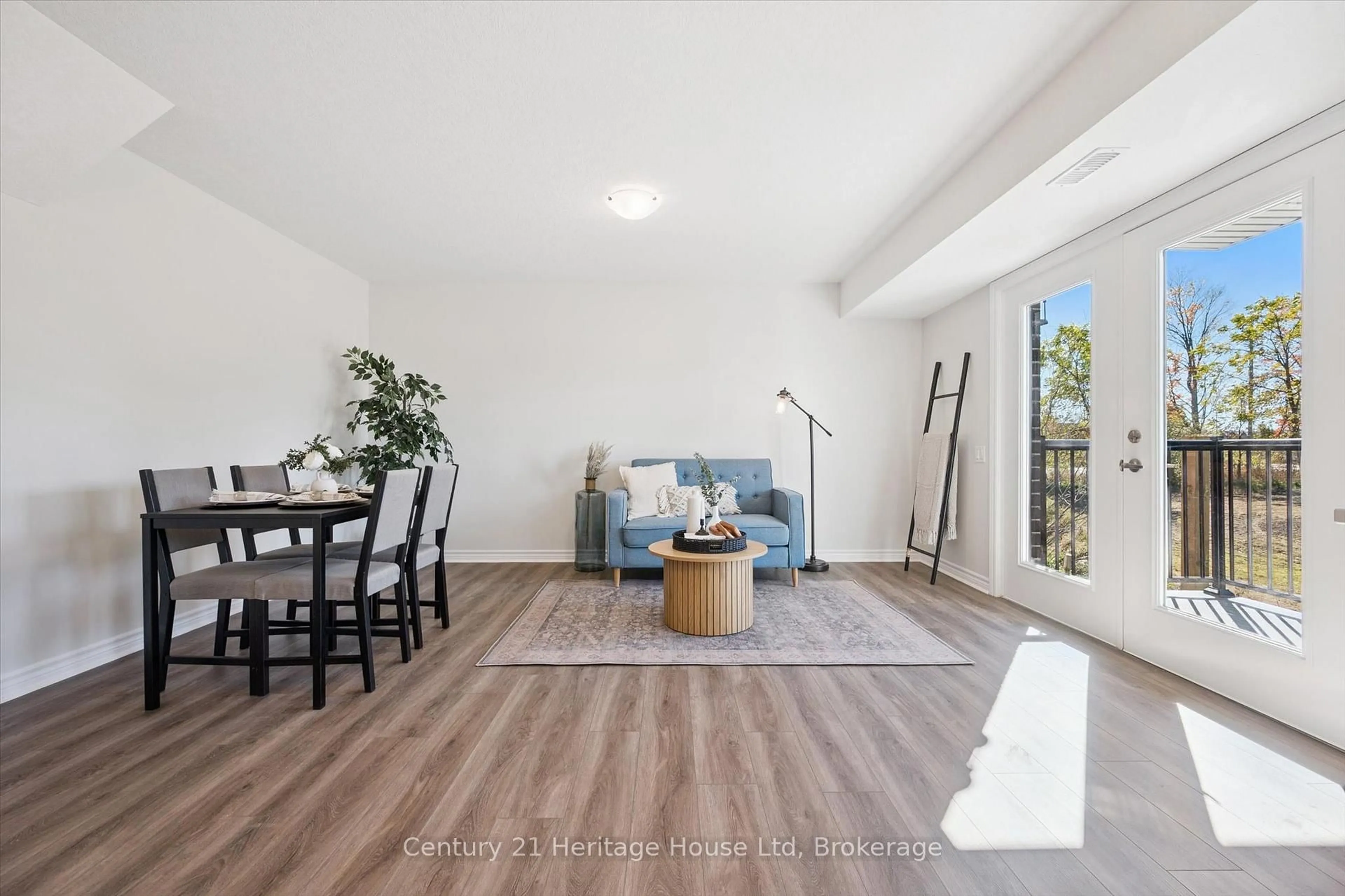 Living room with furniture, wood/laminate floor for 465 Garafraxa St #5, Centre Wellington Ontario N1M 0L6