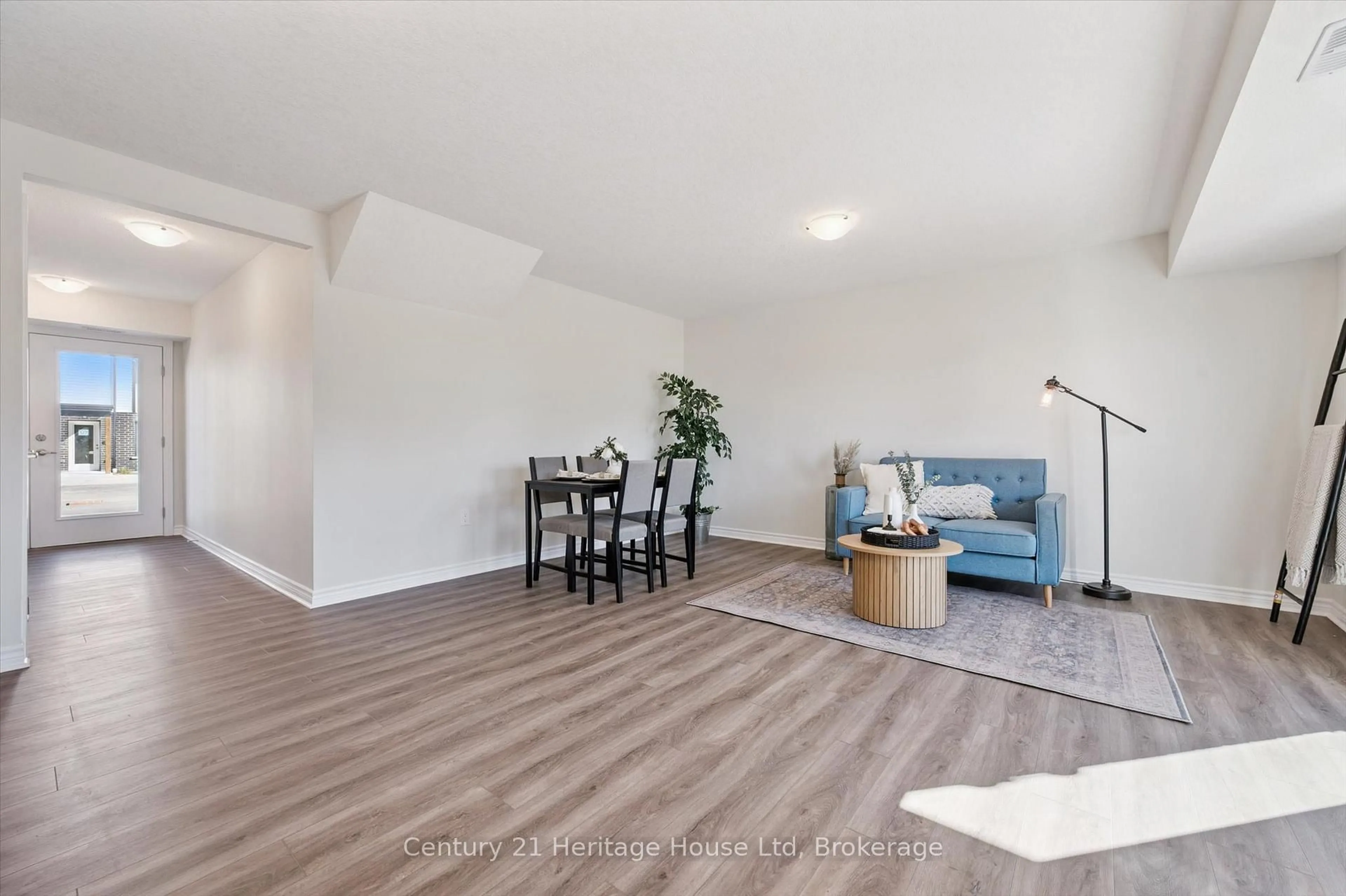 Living room with furniture, wood/laminate floor for 465 Garafraxa St #5, Centre Wellington Ontario N1M 0L6