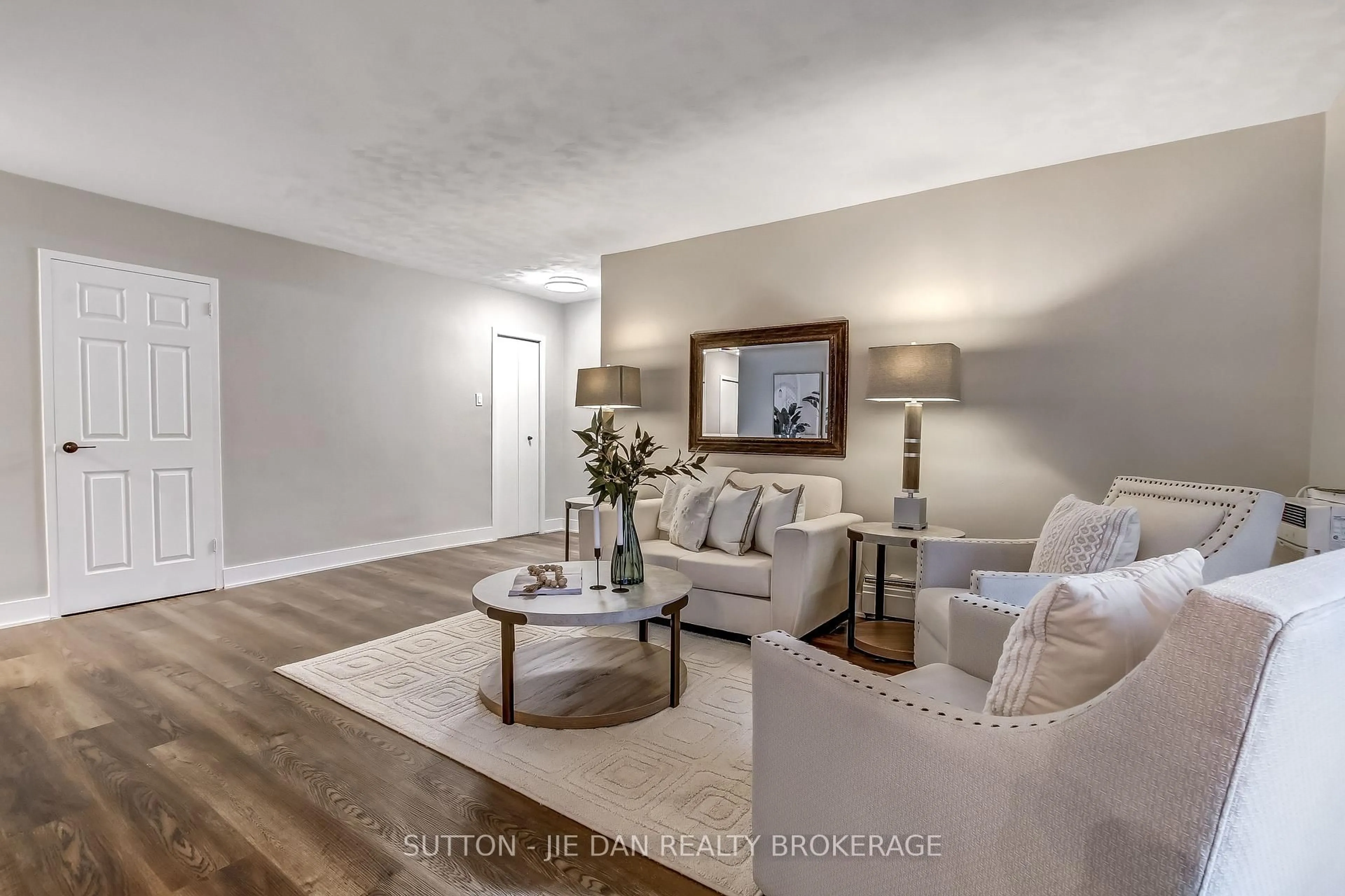 Living room with furniture, wood/laminate floor for 635 WONDERLAND Rd #11, London South Ontario N6K 1M1