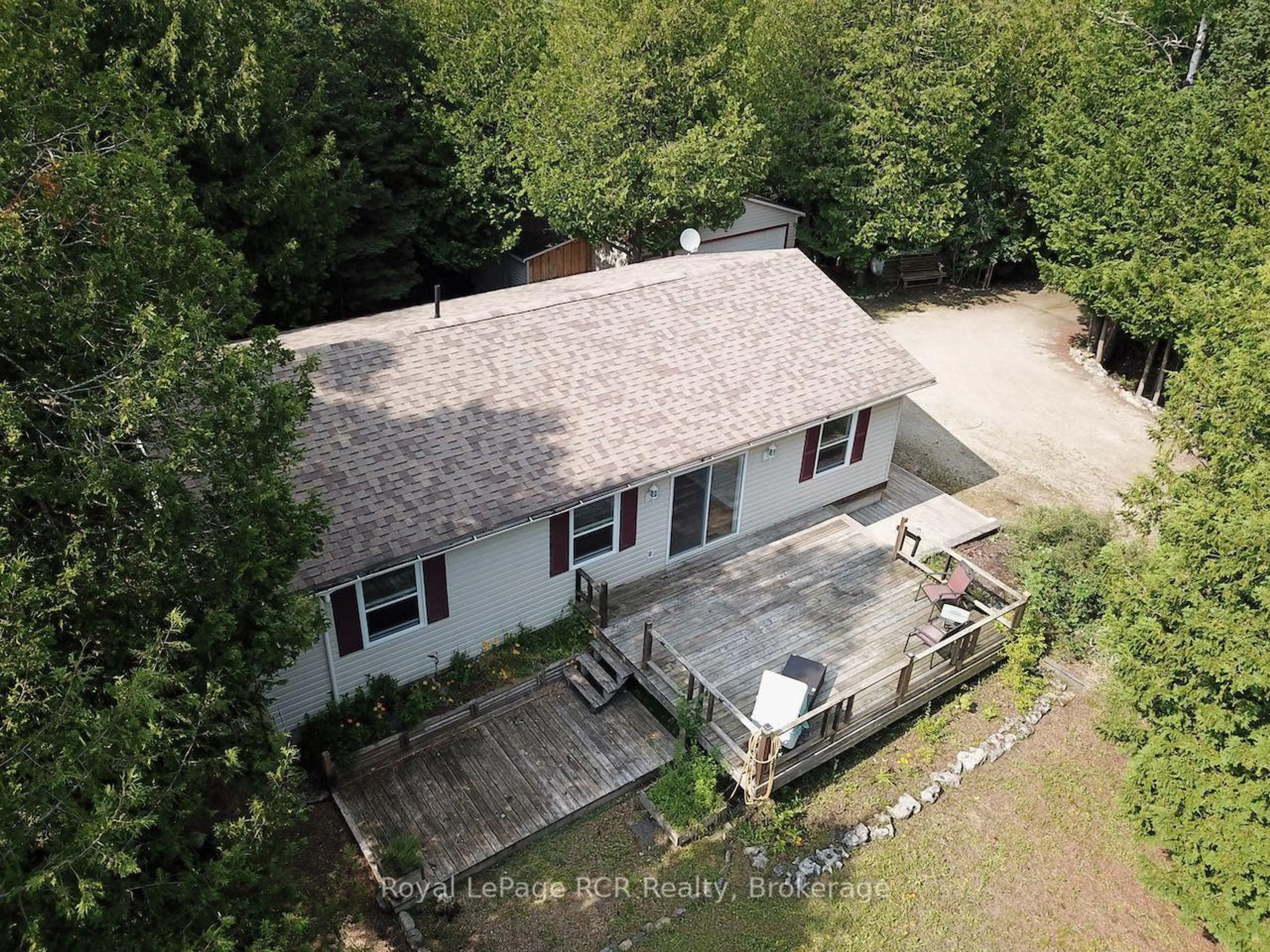 A pic from outside/outdoor area/front of a property/back of a property/a pic from drone, unknown for 323 East Rd, Northern Bruce Peninsula Ontario N0H 1W0
