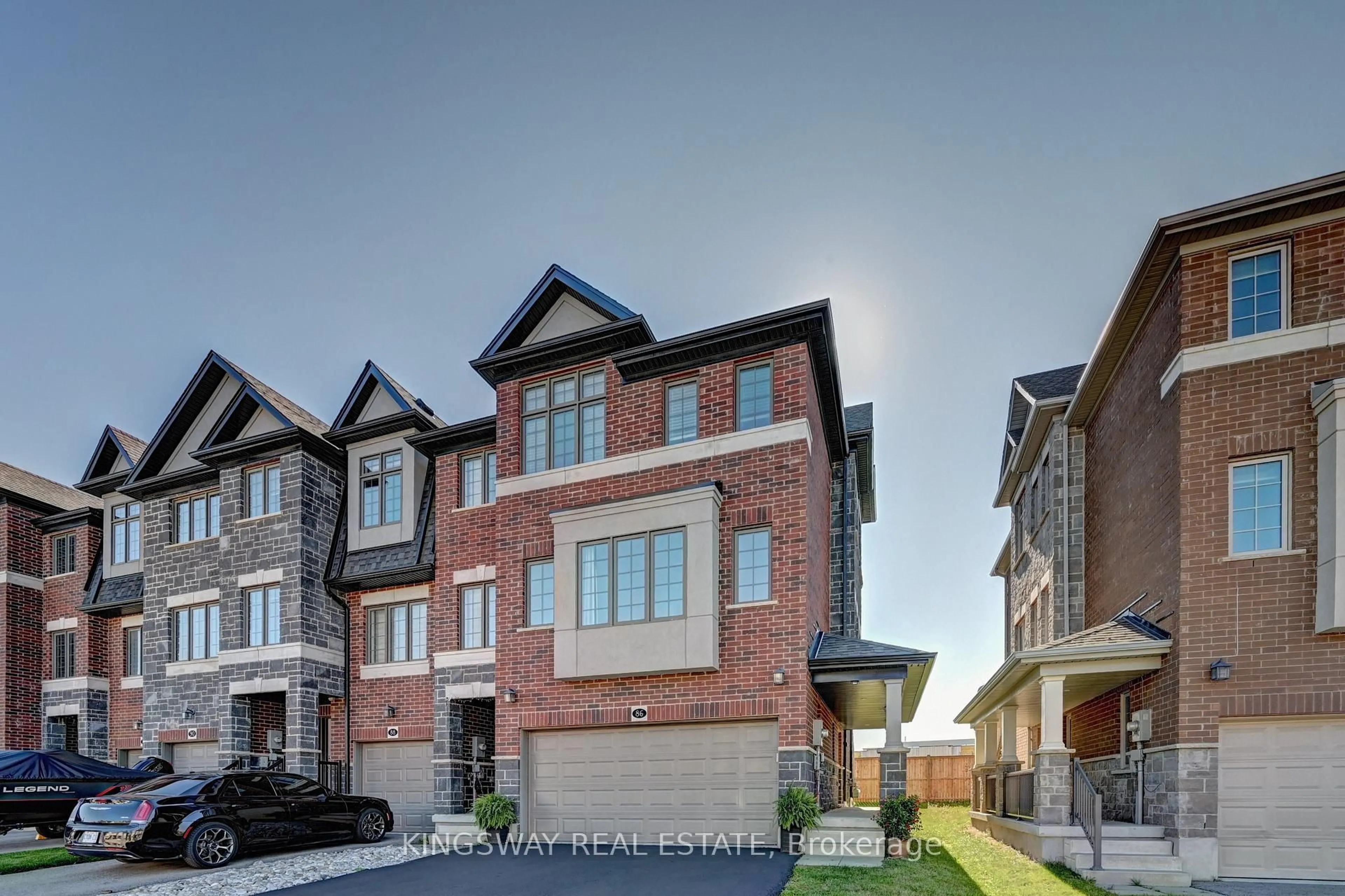 Home with brick exterior material, street for 86 Monarch Woods Dr, Kitchener Ontario N2P 2Y9