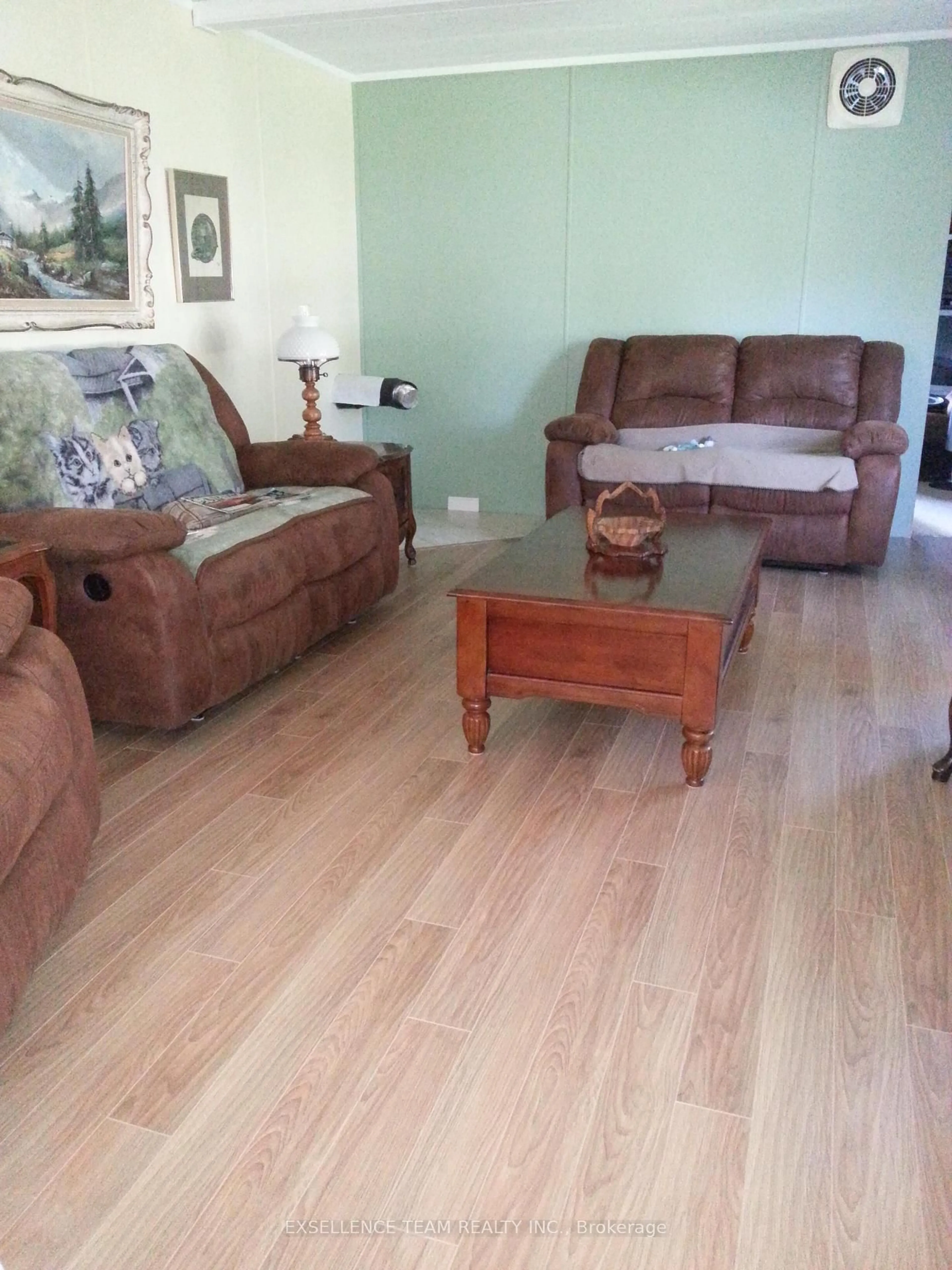Living room with furniture, wood/laminate floor for 3912 Bobby St, North Glengarry Ontario K0C 1A0