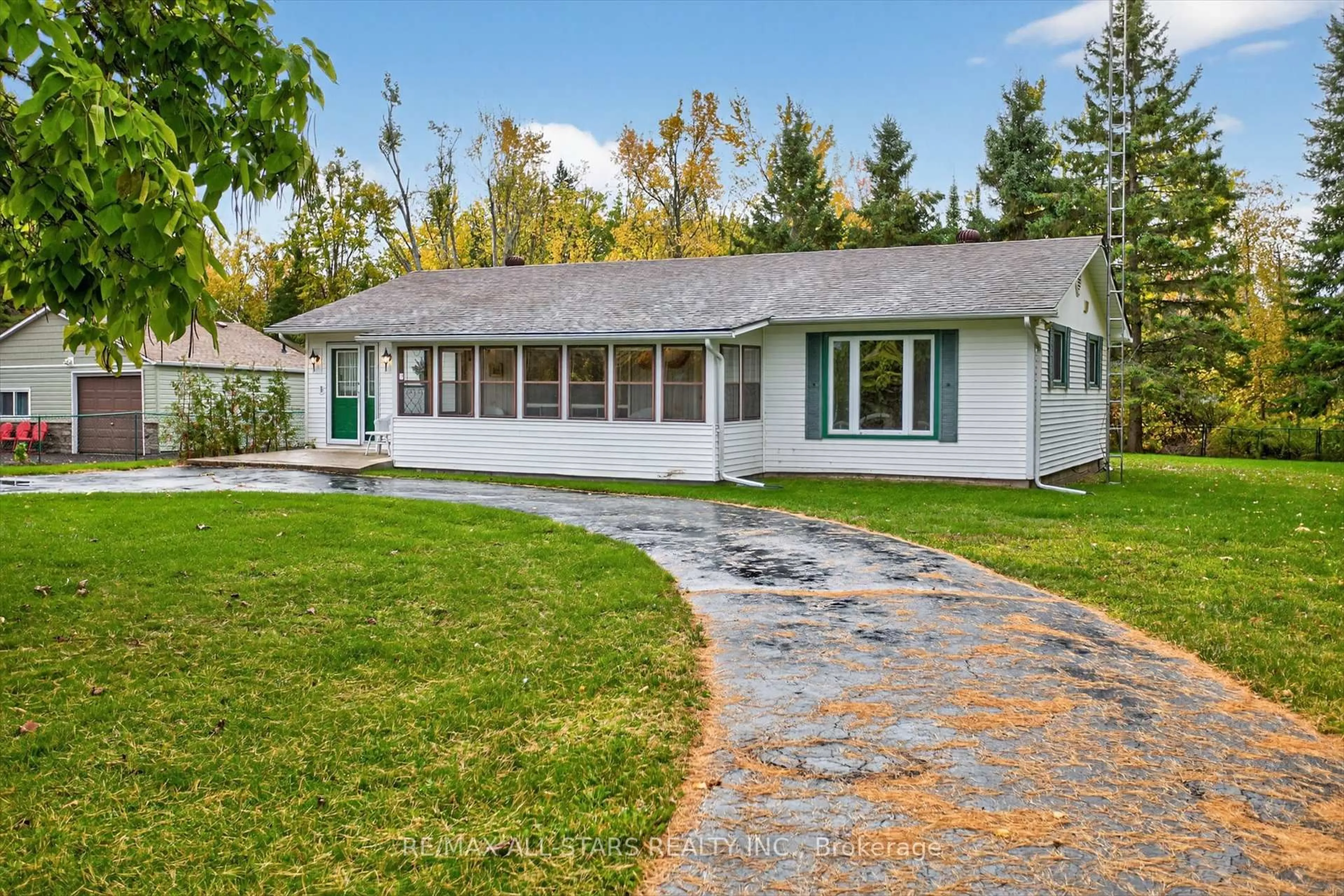 Home with vinyl exterior material, street for 104 Trent Canal Rd, Kawartha Lakes Ontario L9P 1M7