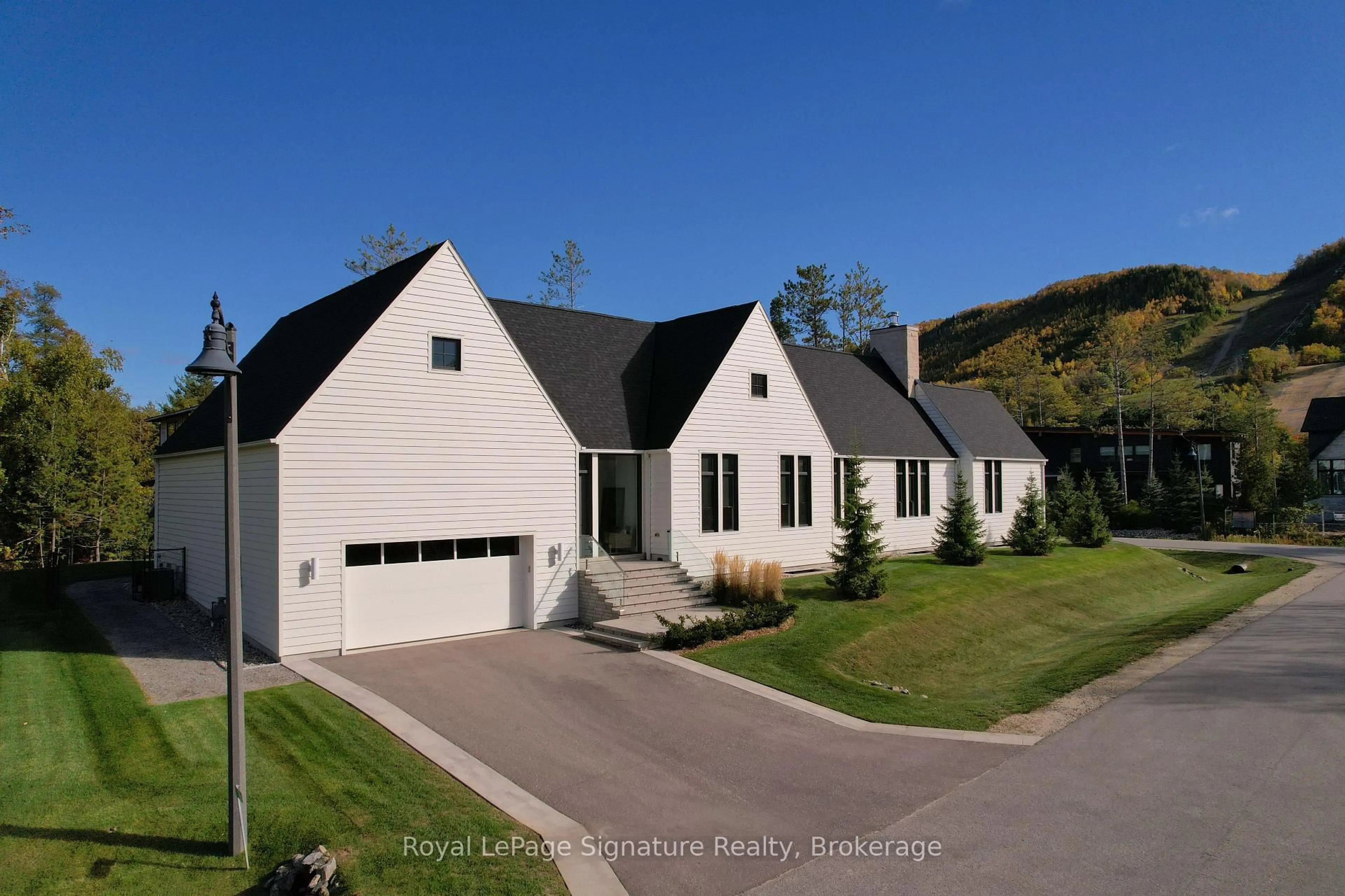 A pic from outside/outdoor area/front of a property/back of a property/a pic from drone, street for 101 Deer Lane, Blue Mountains Ontario N0H 1J0