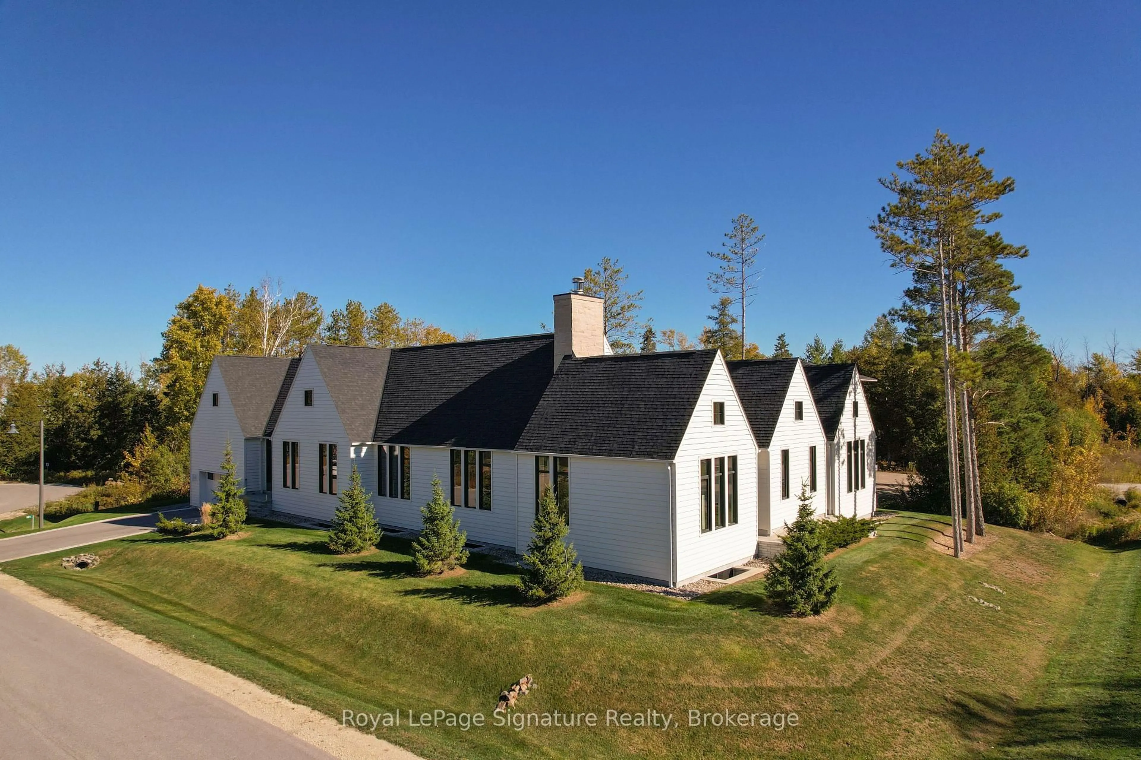 A pic from outside/outdoor area/front of a property/back of a property/a pic from drone, street for 101 Deer Lane, Blue Mountains Ontario N0H 1J0