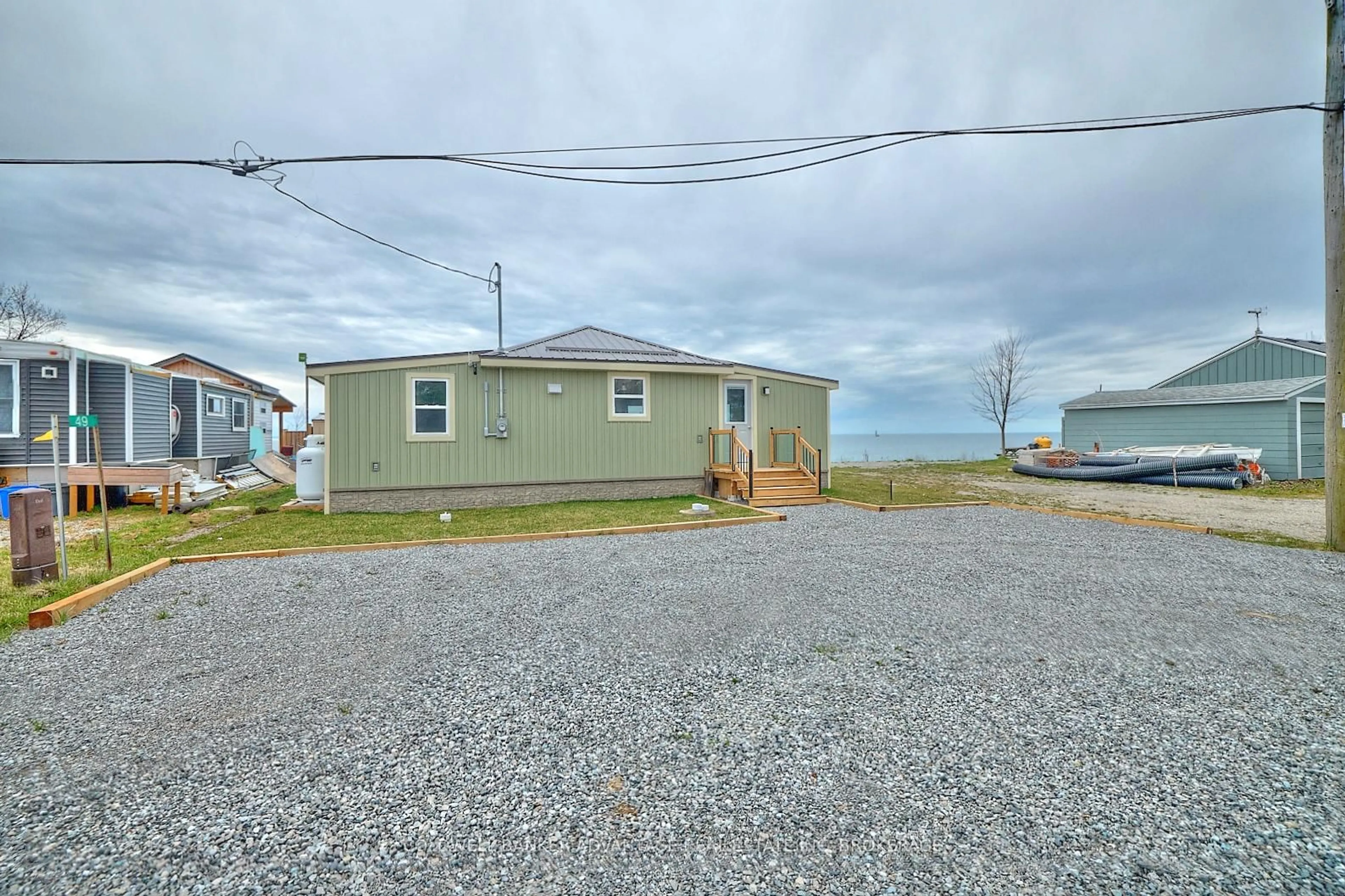 A pic from outside/outdoor area/front of a property/back of a property/a pic from drone, street for 49 Derner Line, Haldimand Ontario N0A 1K0