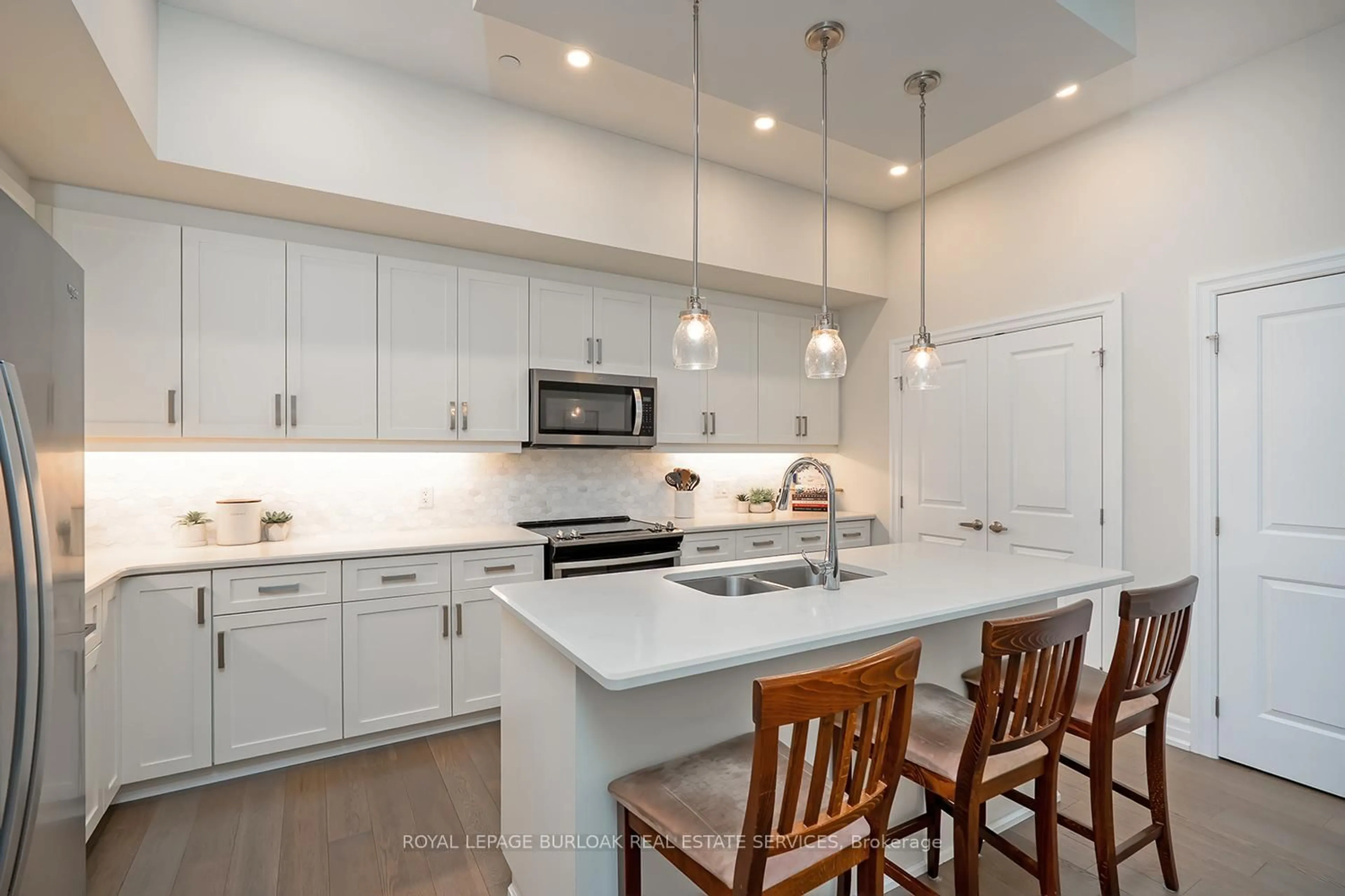 Open concept kitchen, ceramic/tile floor for 1878 Gordon St #202, Guelph Ontario N1L 0P4