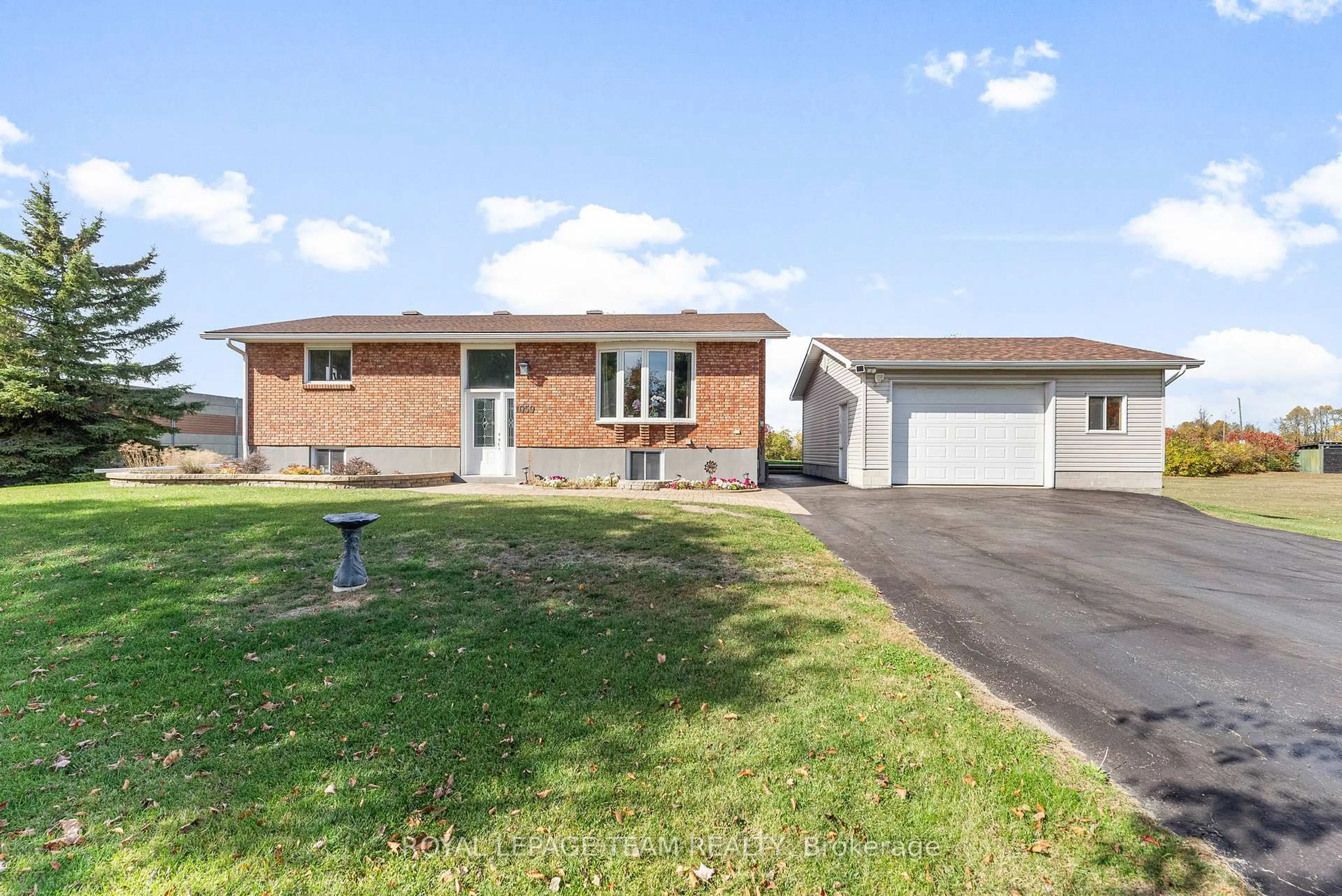 Home with brick exterior material, street for 1059 Flynn Ave, Ottawa Ontario K7S 3G7