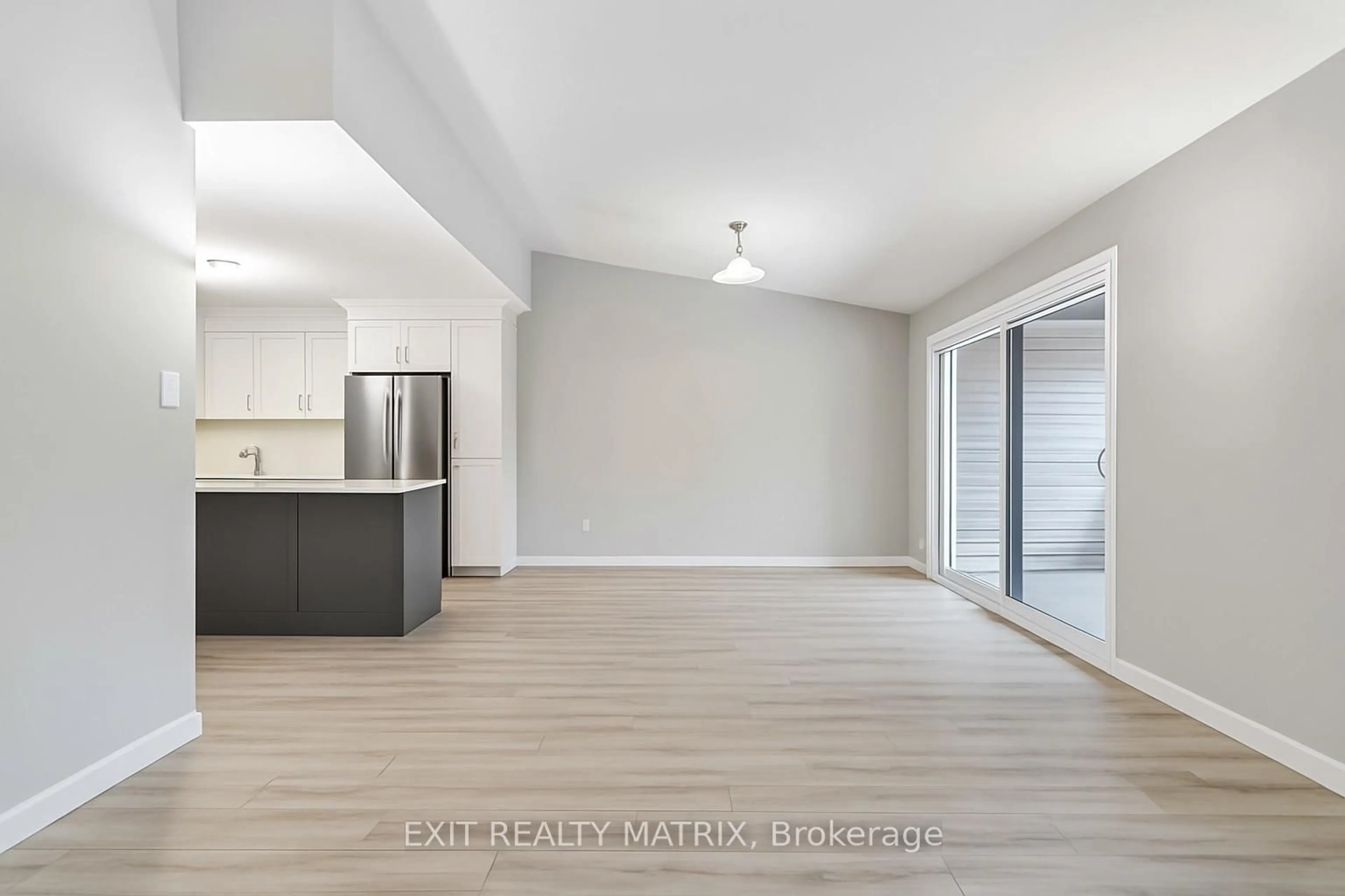 Open concept kitchen, wood/laminate floor for 99 St Moritz Tr #410, Russell Ontario K0A 1W0