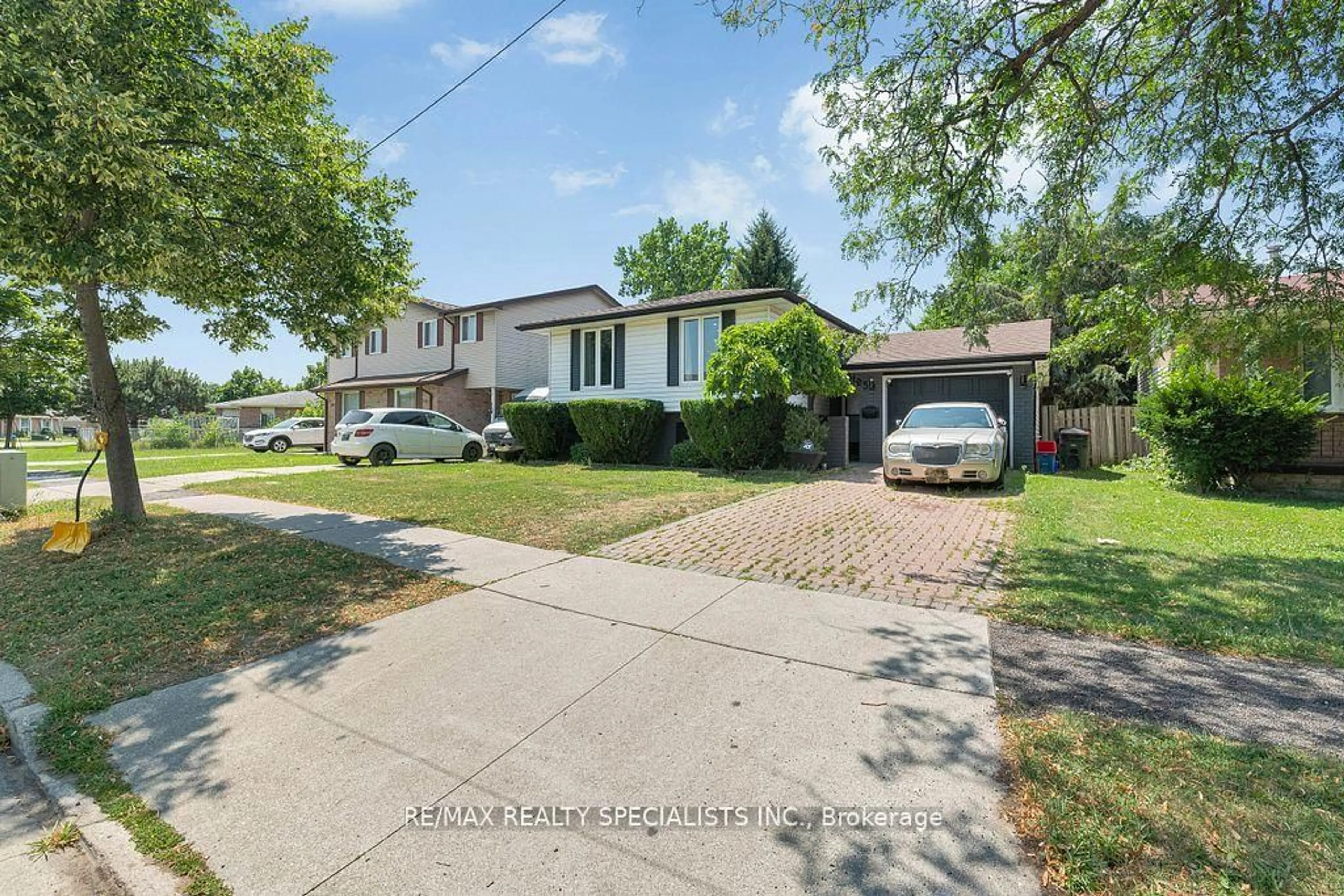 A pic from outside/outdoor area/front of a property/back of a property/a pic from drone, street for 3195 Conservation Dr, Windsor Ontario N8W 5B8