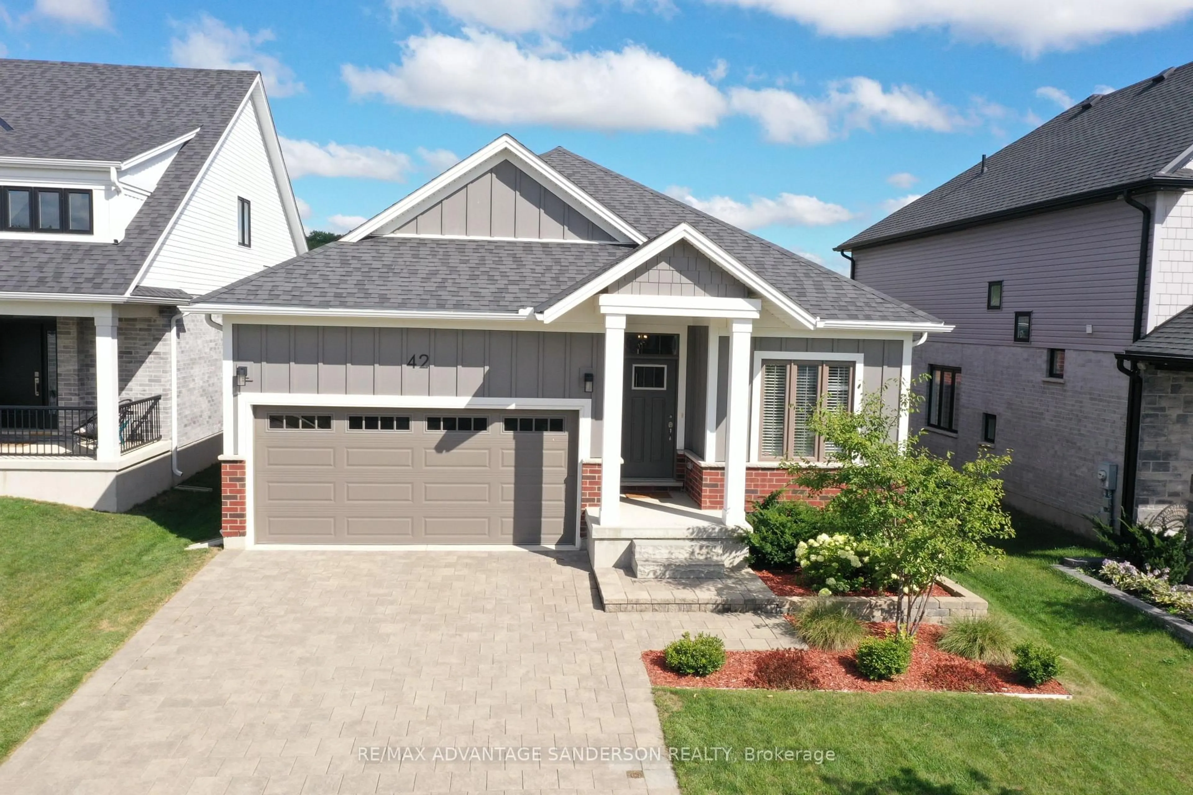 Home with vinyl exterior material, street for 42 Bowman Dr, Middlesex Centre Ontario N0M 2A0