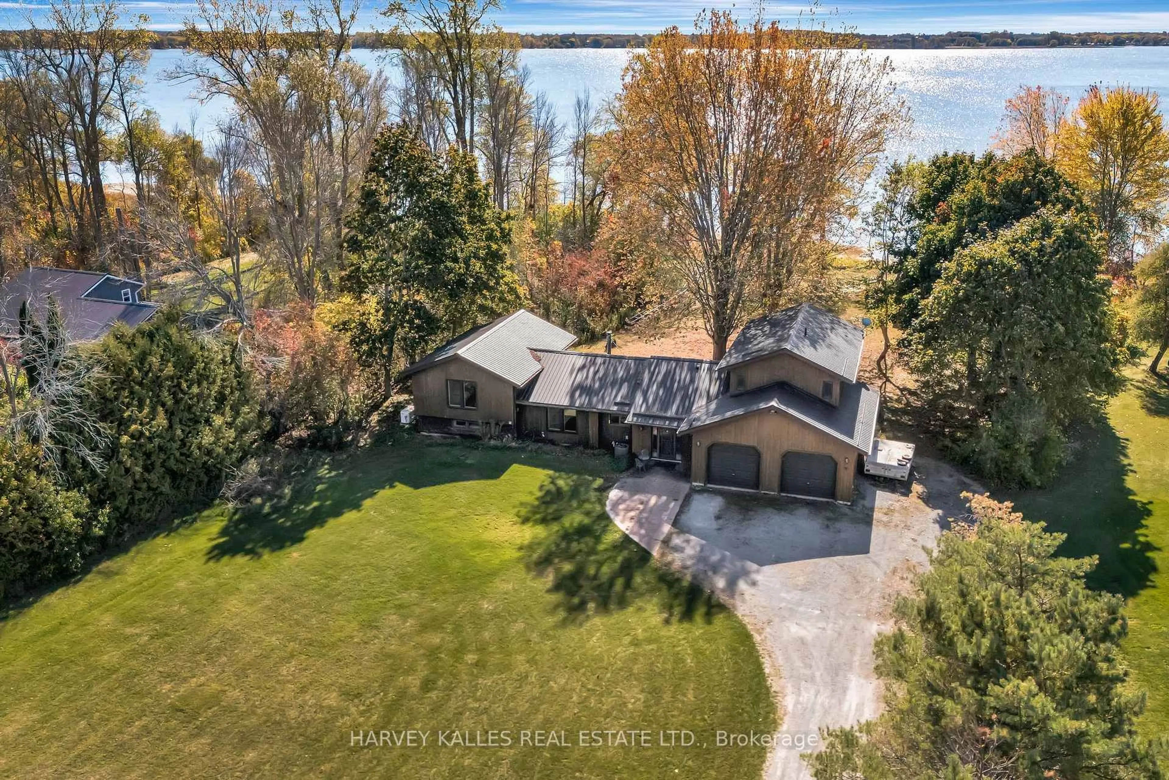 A pic from outside/outdoor area/front of a property/back of a property/a pic from drone, water/lake/river/ocean view for 38 Vienna Rd, Prince Edward County Ontario K0K 1T0