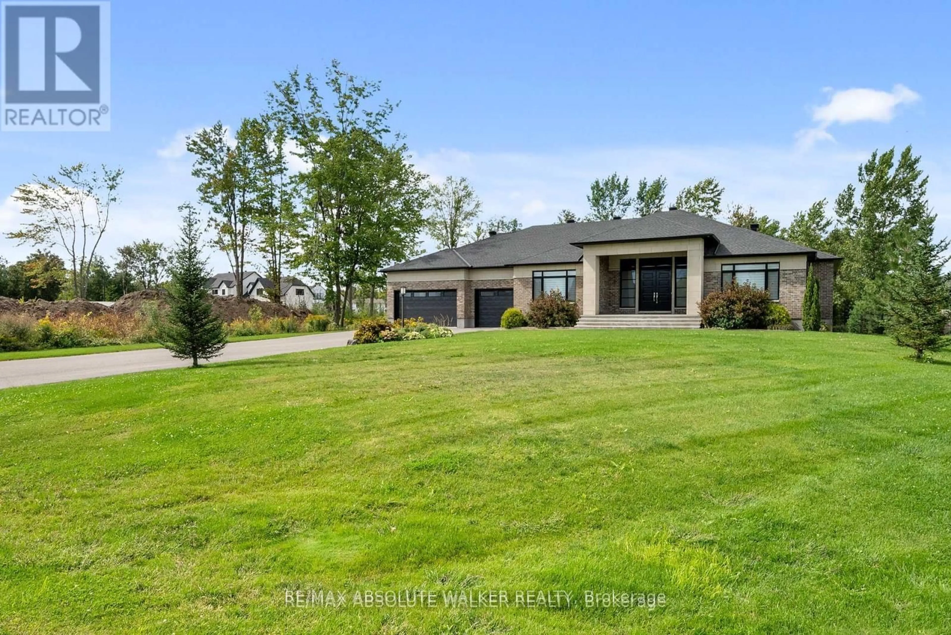 A pic from outside/outdoor area/front of a property/back of a property/a pic from drone, water/lake/river/ocean view for 700 Mcmanus Ave, Manotick Ontario K4M 0B2