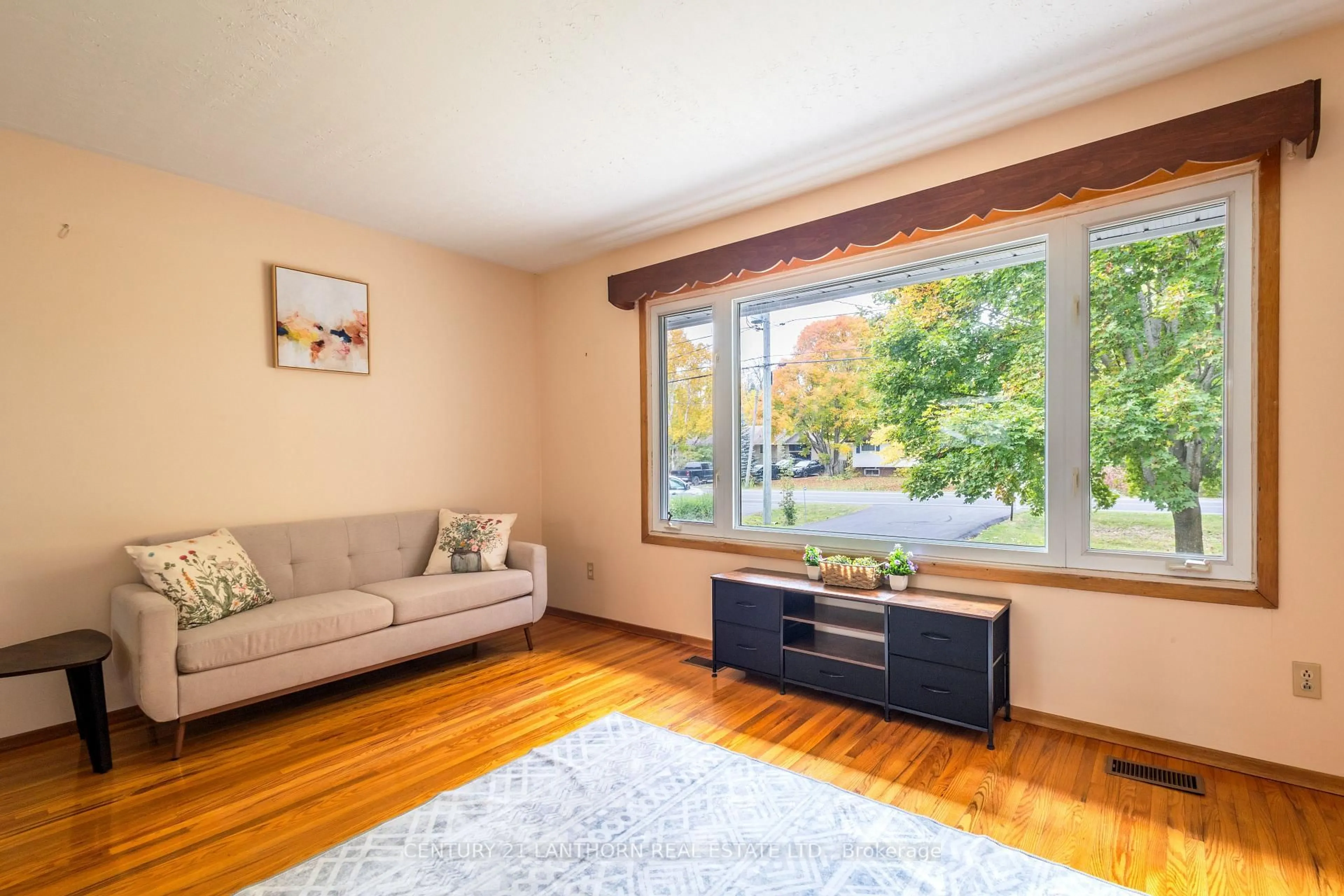 Living room with furniture, wood/laminate floor for 394 Montrose Rd, Quinte West Ontario K8R 1A9