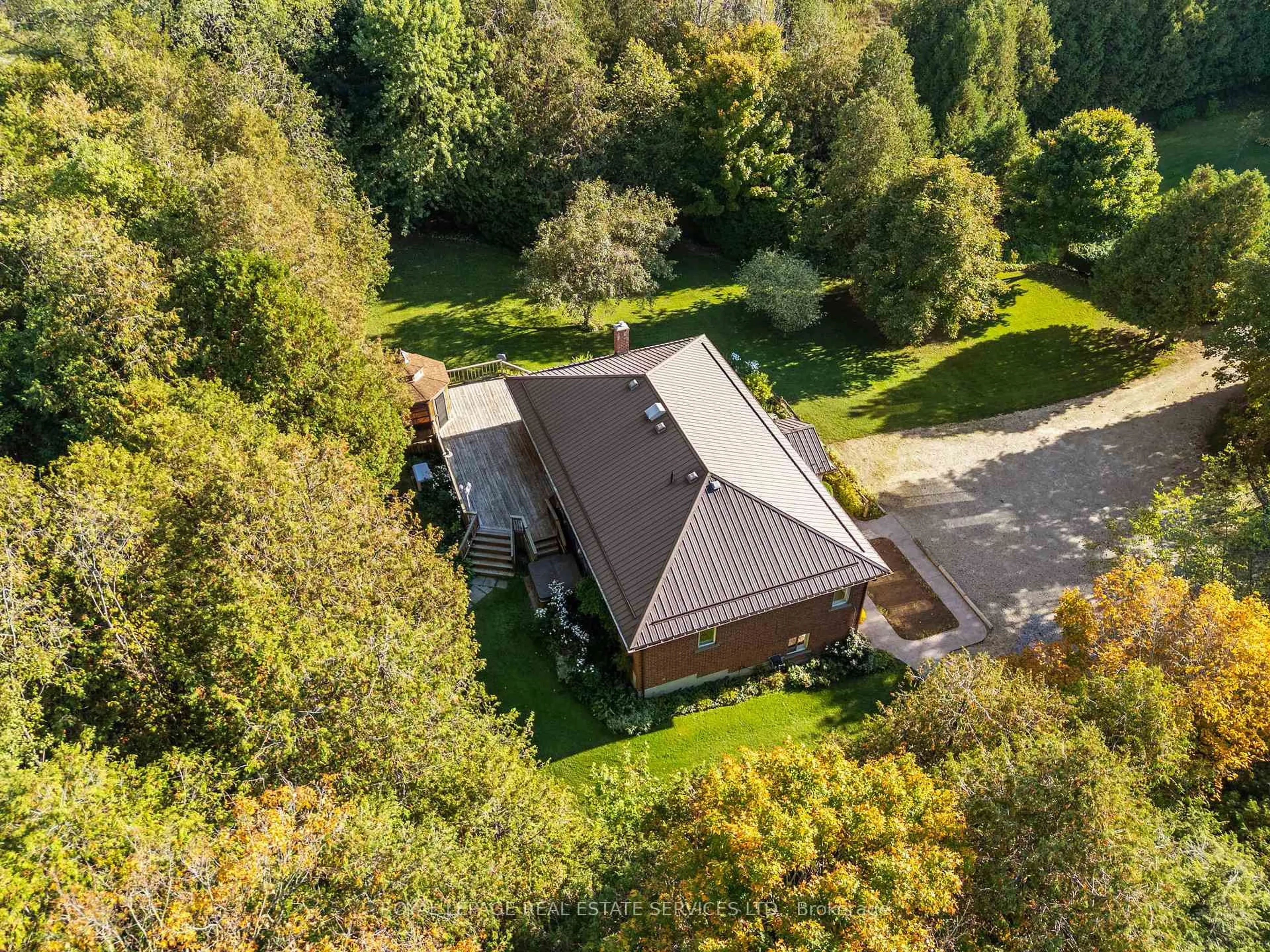 A pic from outside/outdoor area/front of a property/back of a property/a pic from drone, forest/trees view for 7174 Highway 89, Wellington North Ontario N0G 2L0