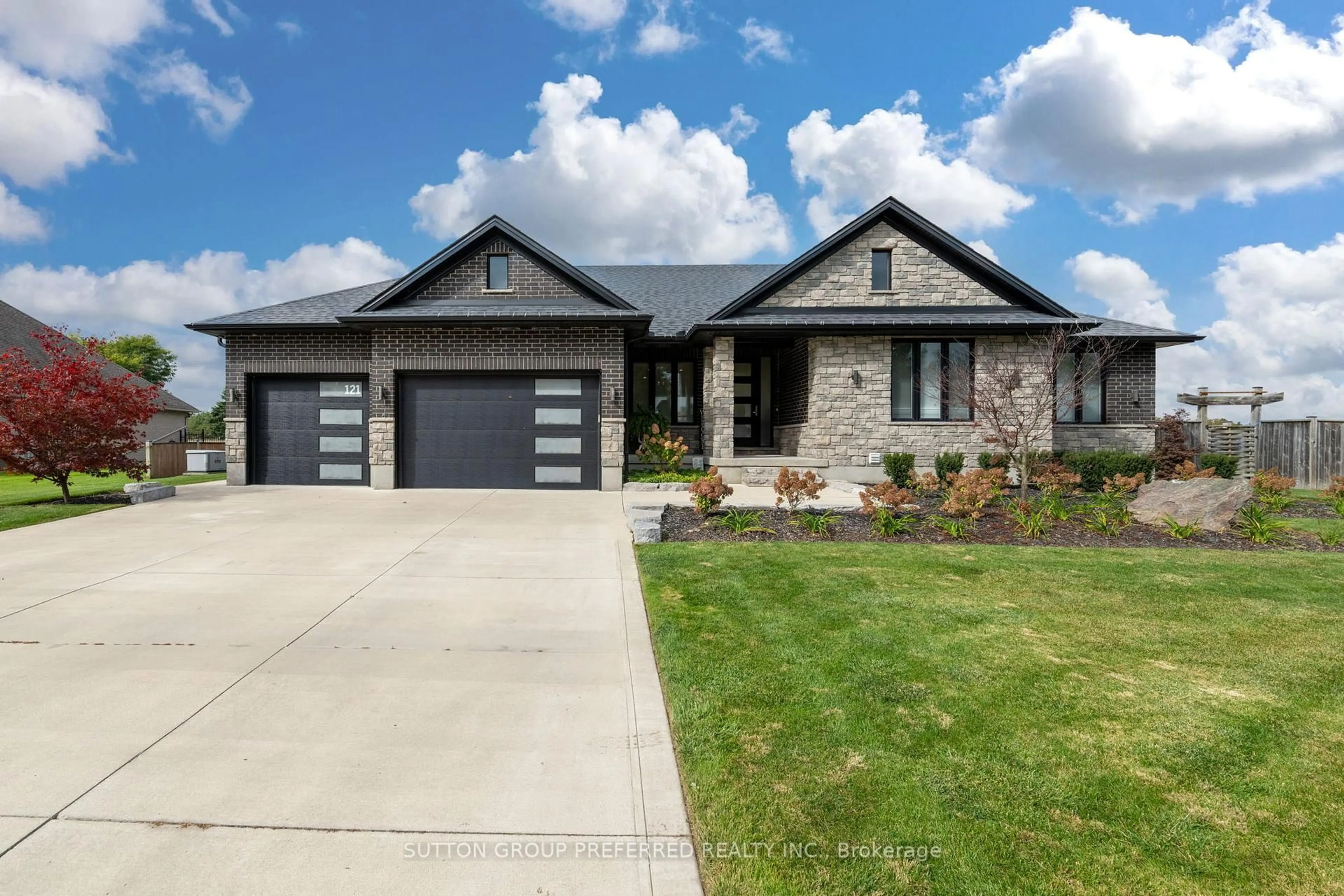 Home with brick exterior material, street for 121 Lewis Dr, Middlesex Centre Ontario N0L 1A0