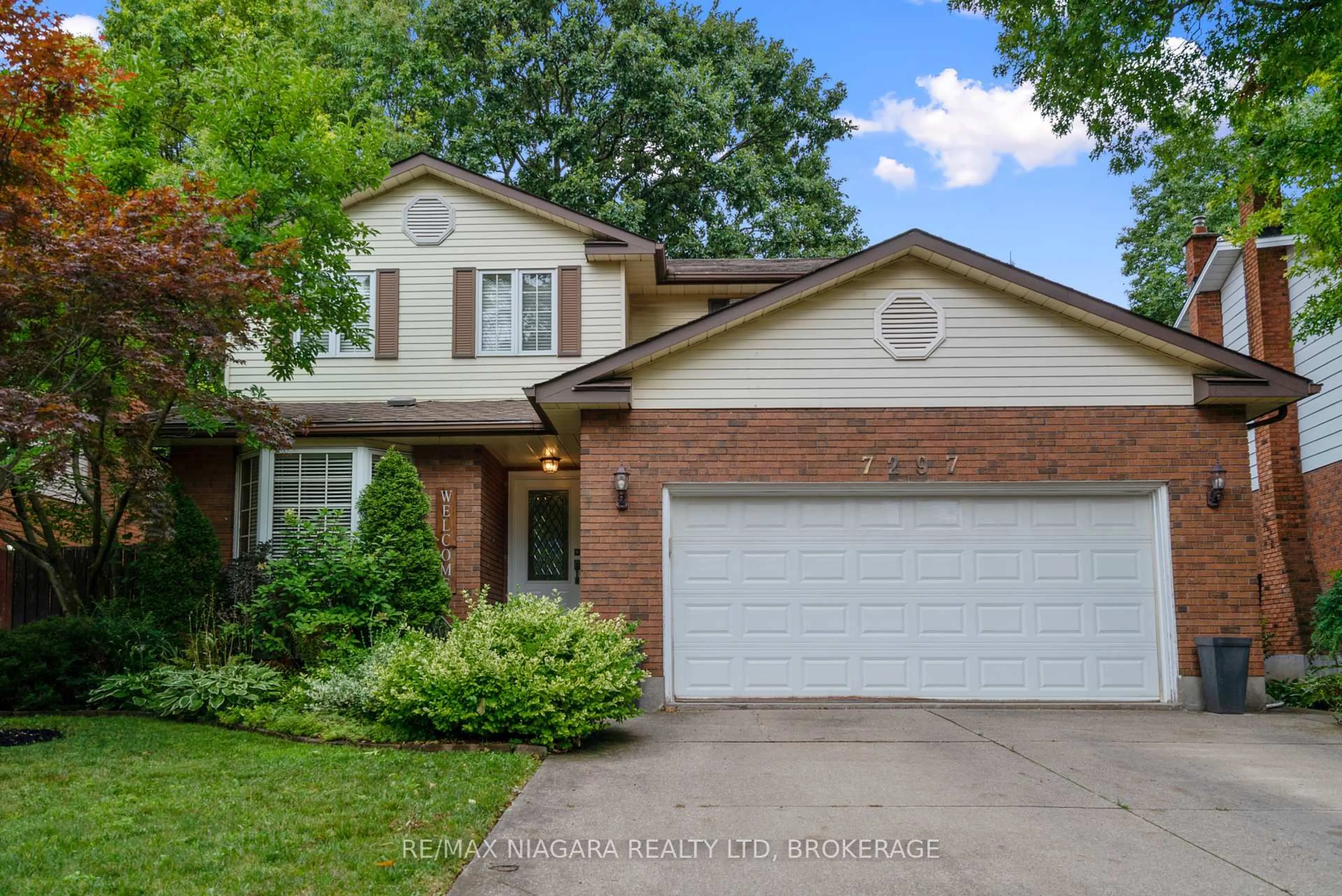 Home with brick exterior material, street for 7297 Green Boughs Rd, Niagara Falls Ontario L2J 3Y8