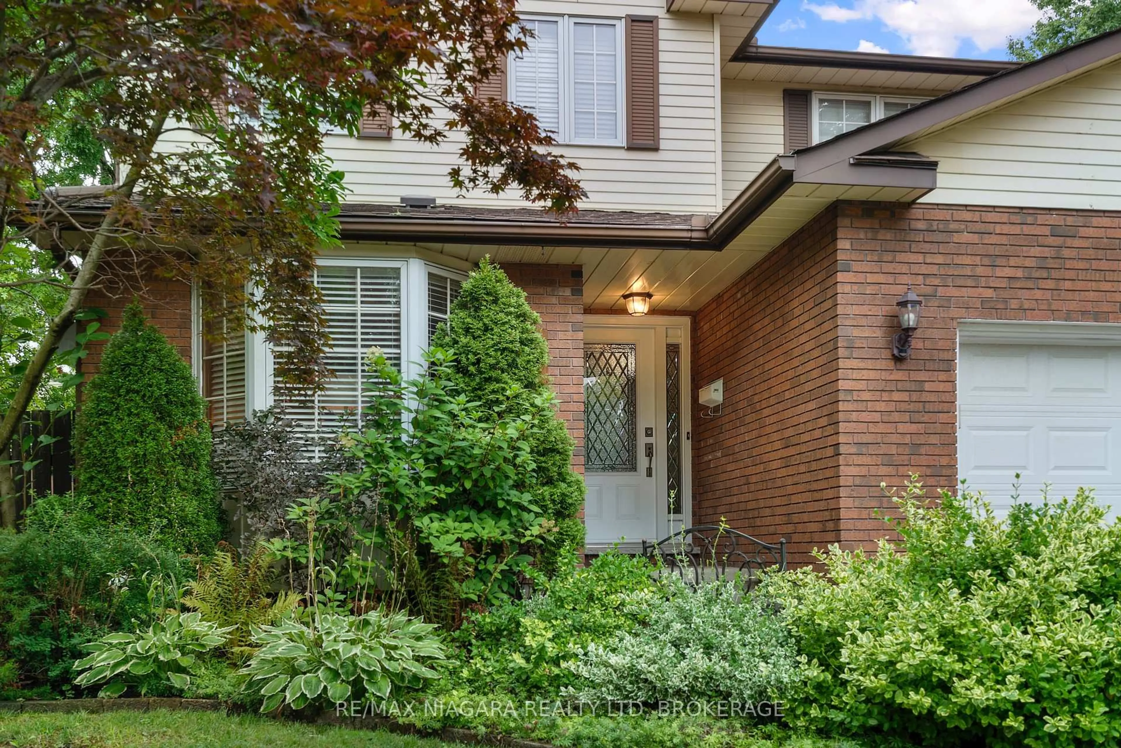 Home with brick exterior material, street for 7297 Green Boughs Rd, Niagara Falls Ontario L2J 3Y8