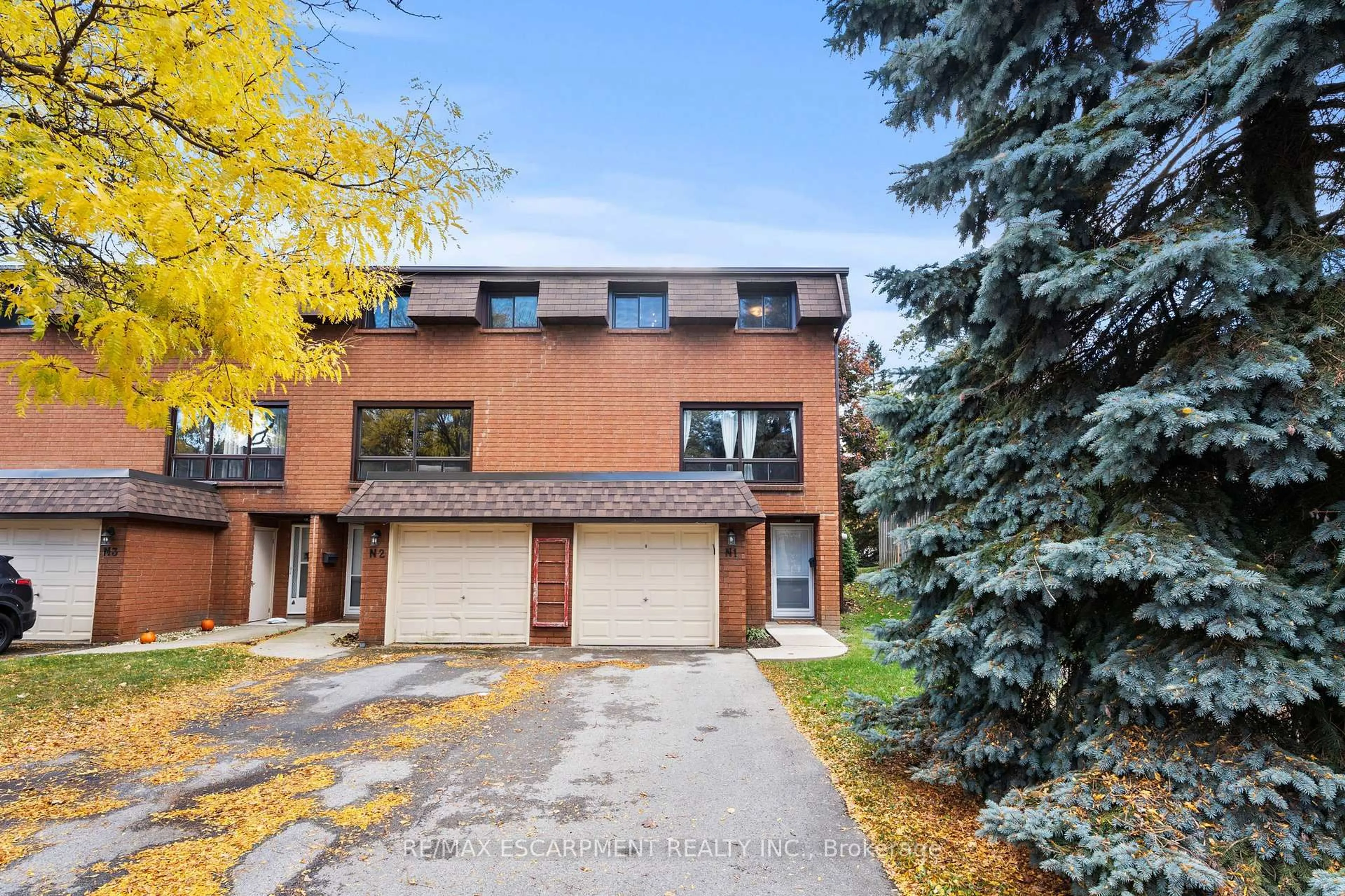 Home with brick exterior material, street for 444 Stone Church Rd #N1, Hamilton Ontario L9B 1R1