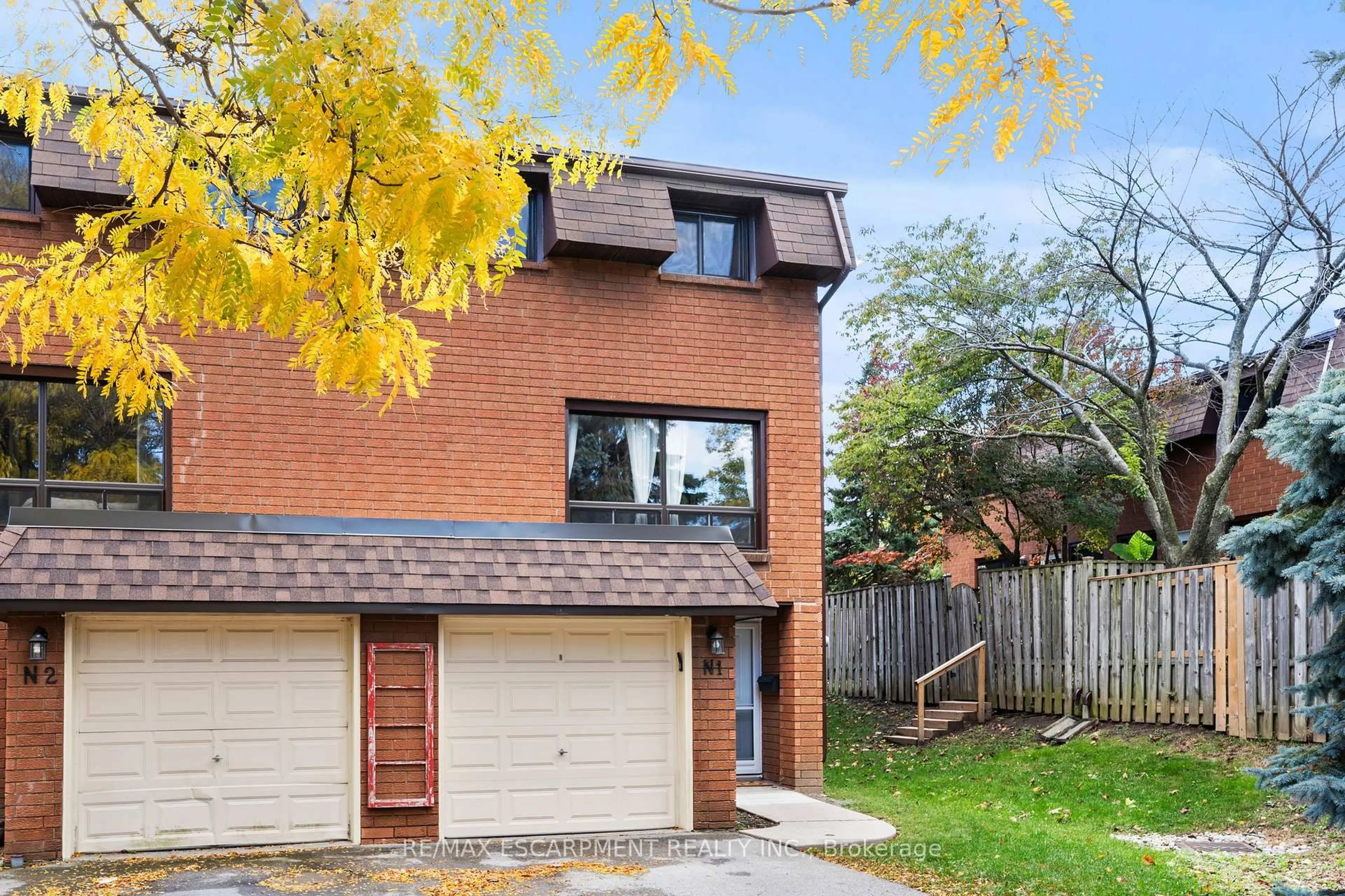 Home with brick exterior material, street for 444 Stone Church Rd #N1, Hamilton Ontario L9B 1R1
