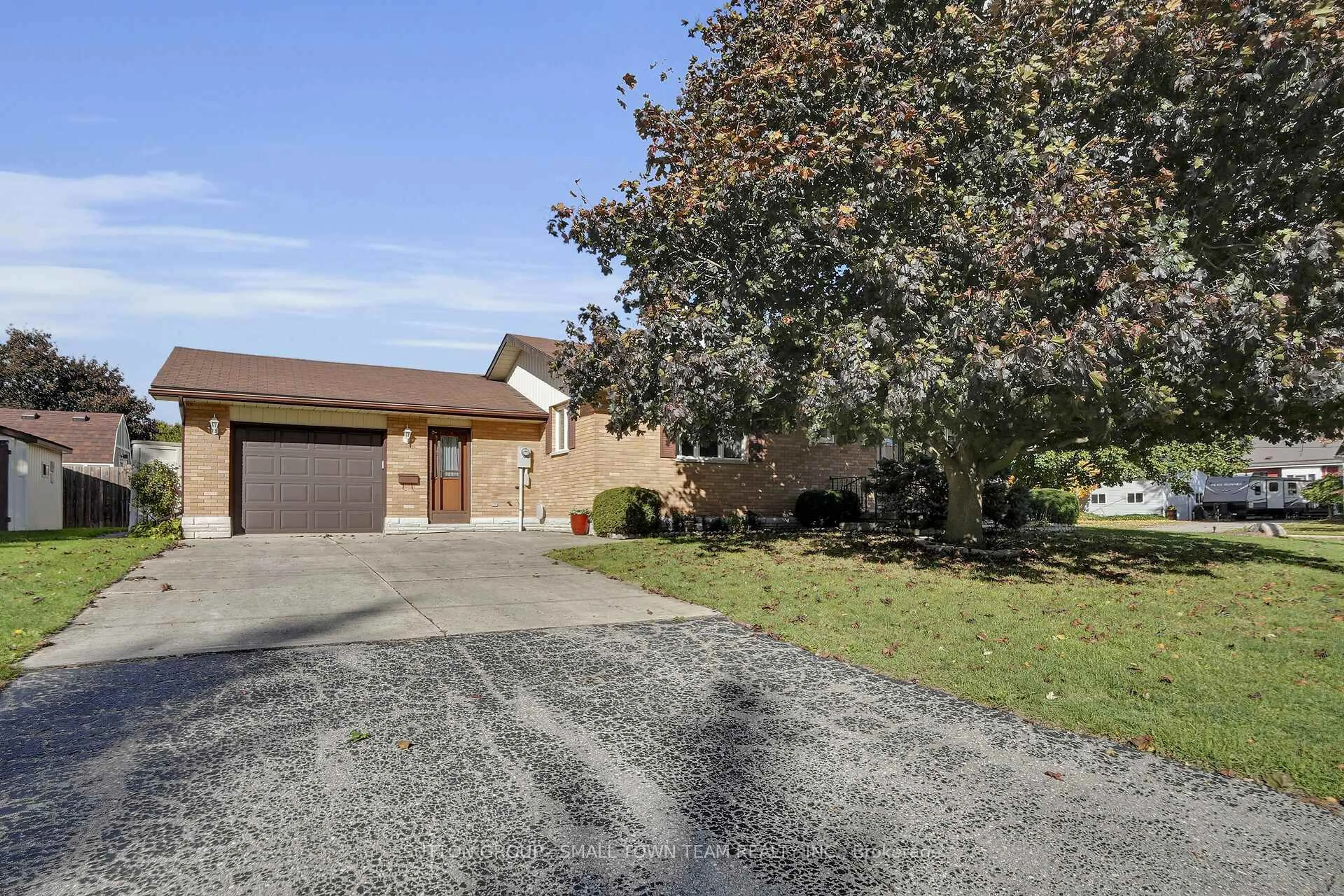 A pic from outside/outdoor area/front of a property/back of a property/a pic from drone, street for 110 John St, South Huron Ontario N0M 1S2