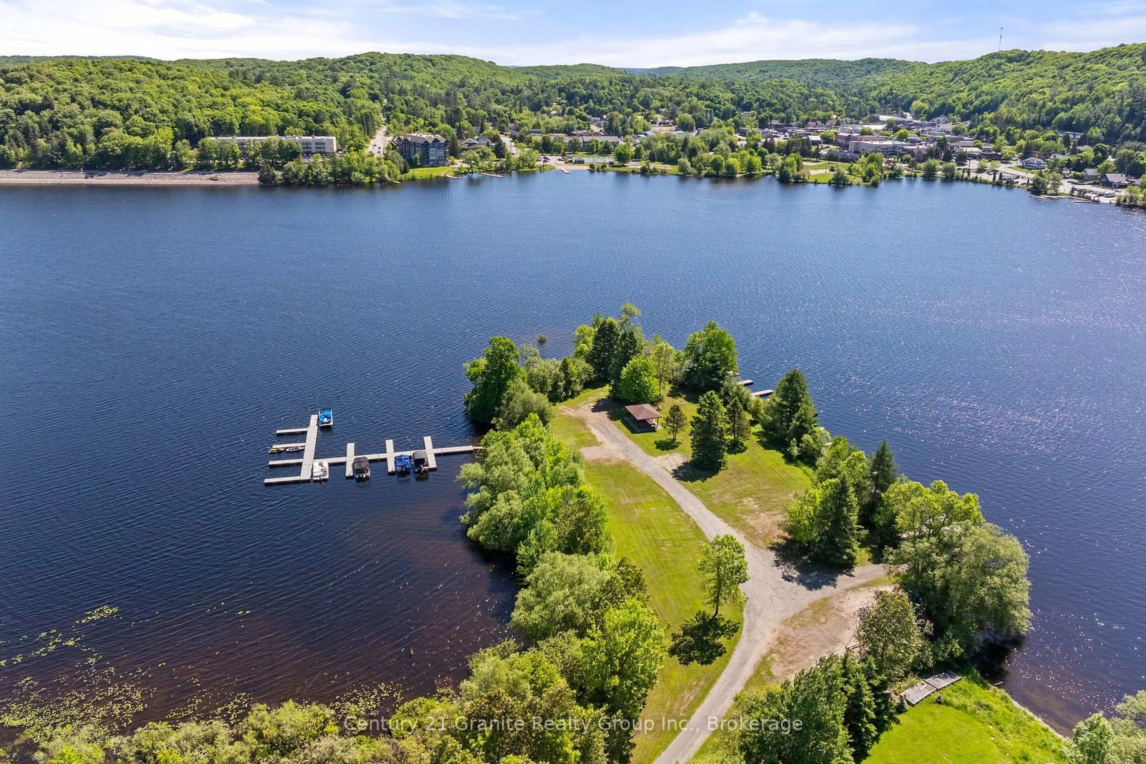 A pic from outside/outdoor area/front of a property/back of a property/a pic from drone, water/lake/river/ocean view for 51 FARMCREST Ave, Dysart et al Ontario K0M 1S0