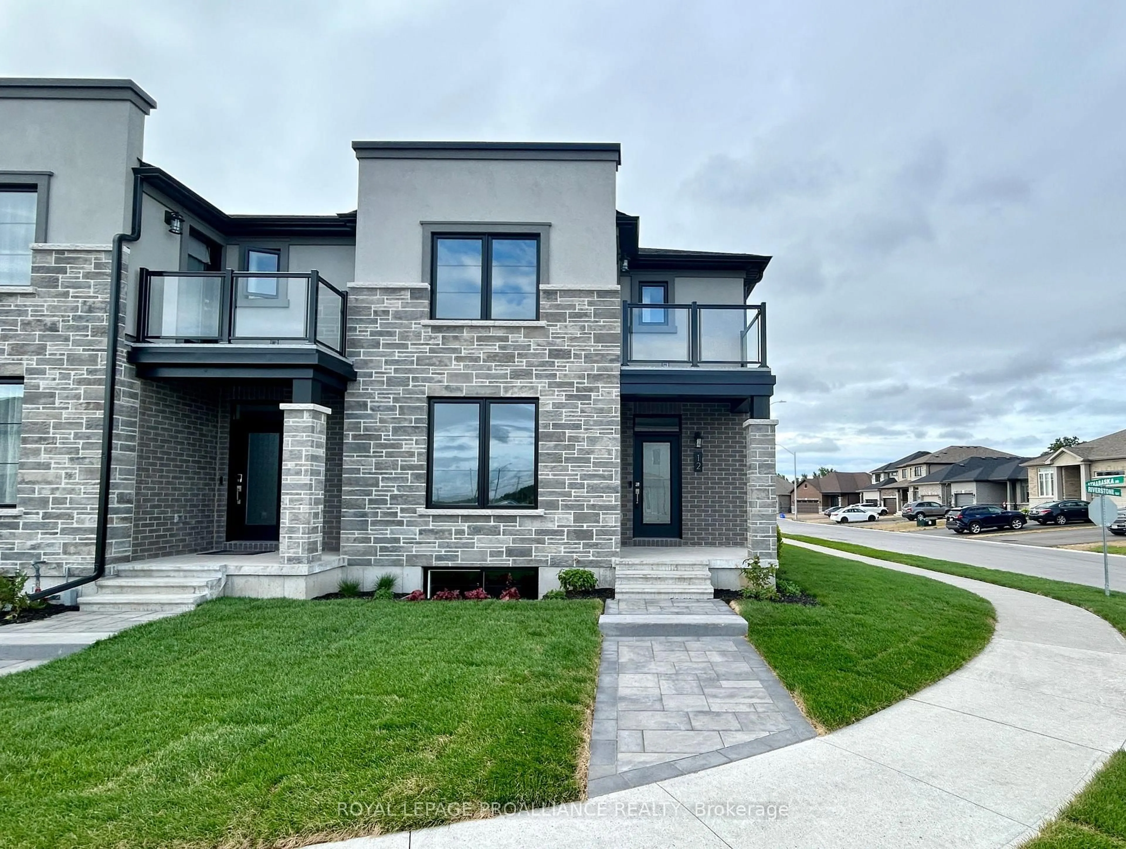 Home with brick exterior material, street for 12 Riverstone Way, Belleville Ontario K8N 0S6