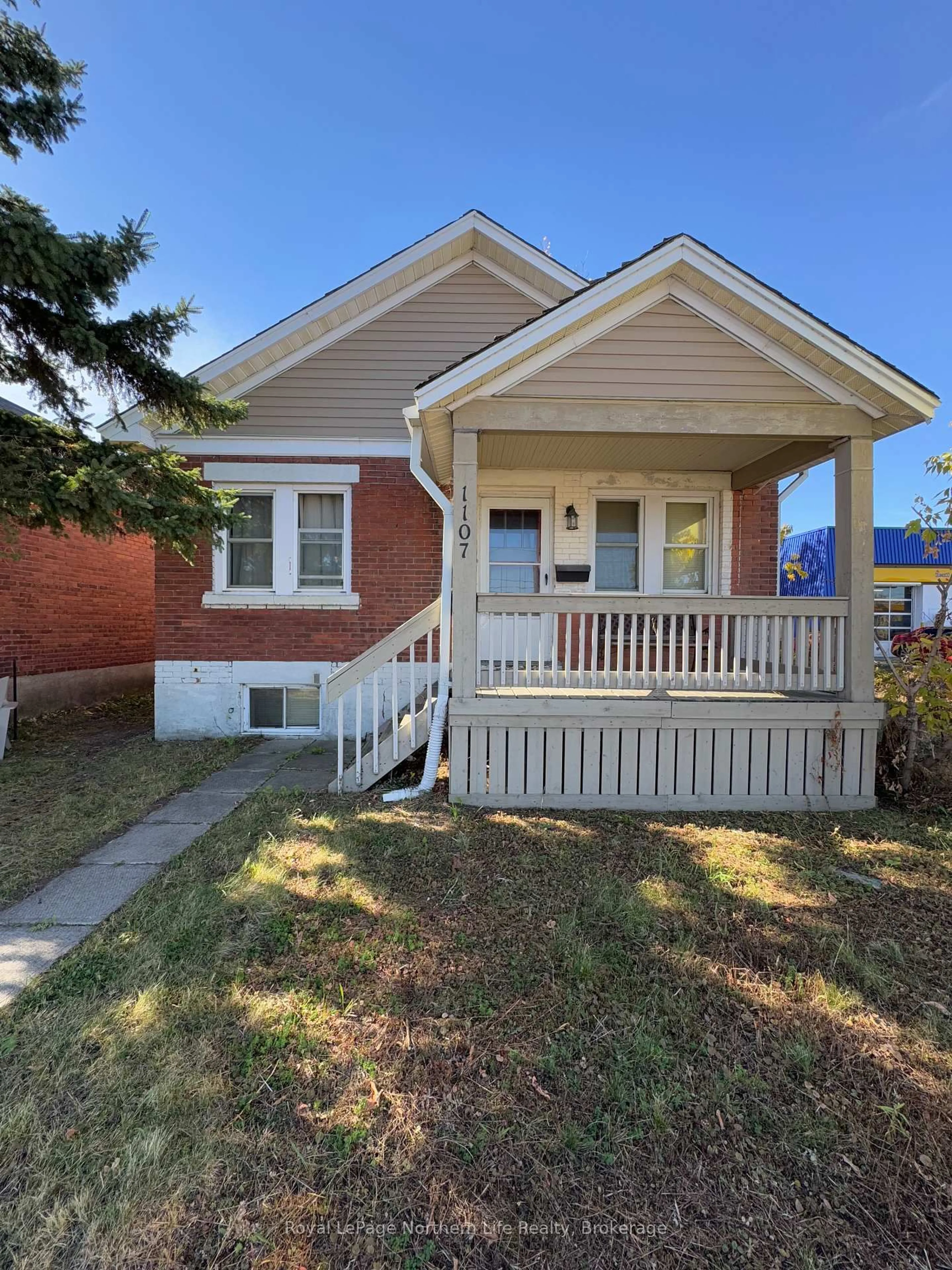 Home with brick exterior material, street for 1107 Algonquin Ave, North Bay Ontario P1B 4Y1