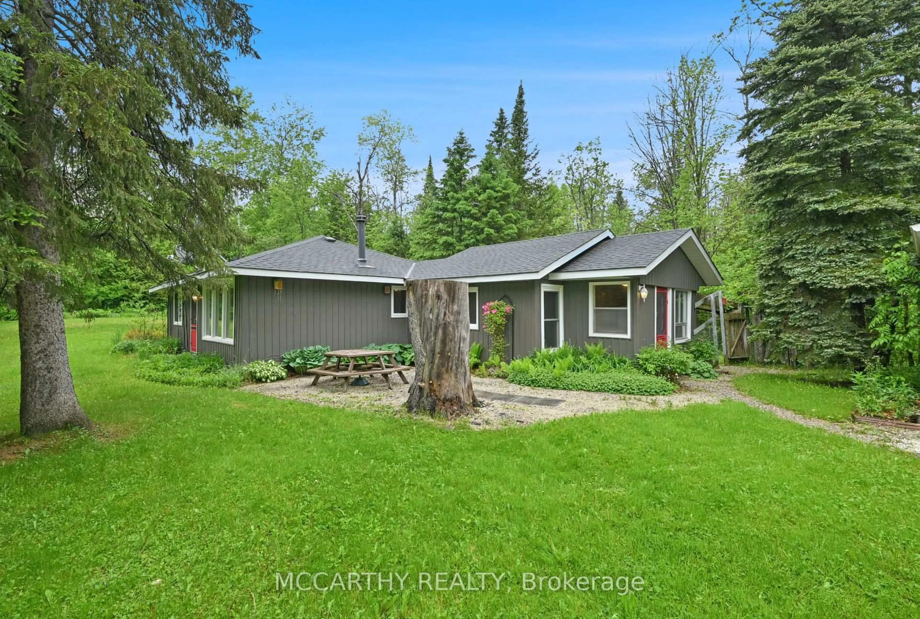 A pic from outside/outdoor area/front of a property/back of a property/a pic from drone, forest/trees view for 606095 River Rd, Mulmur Ontario L9V 0S9