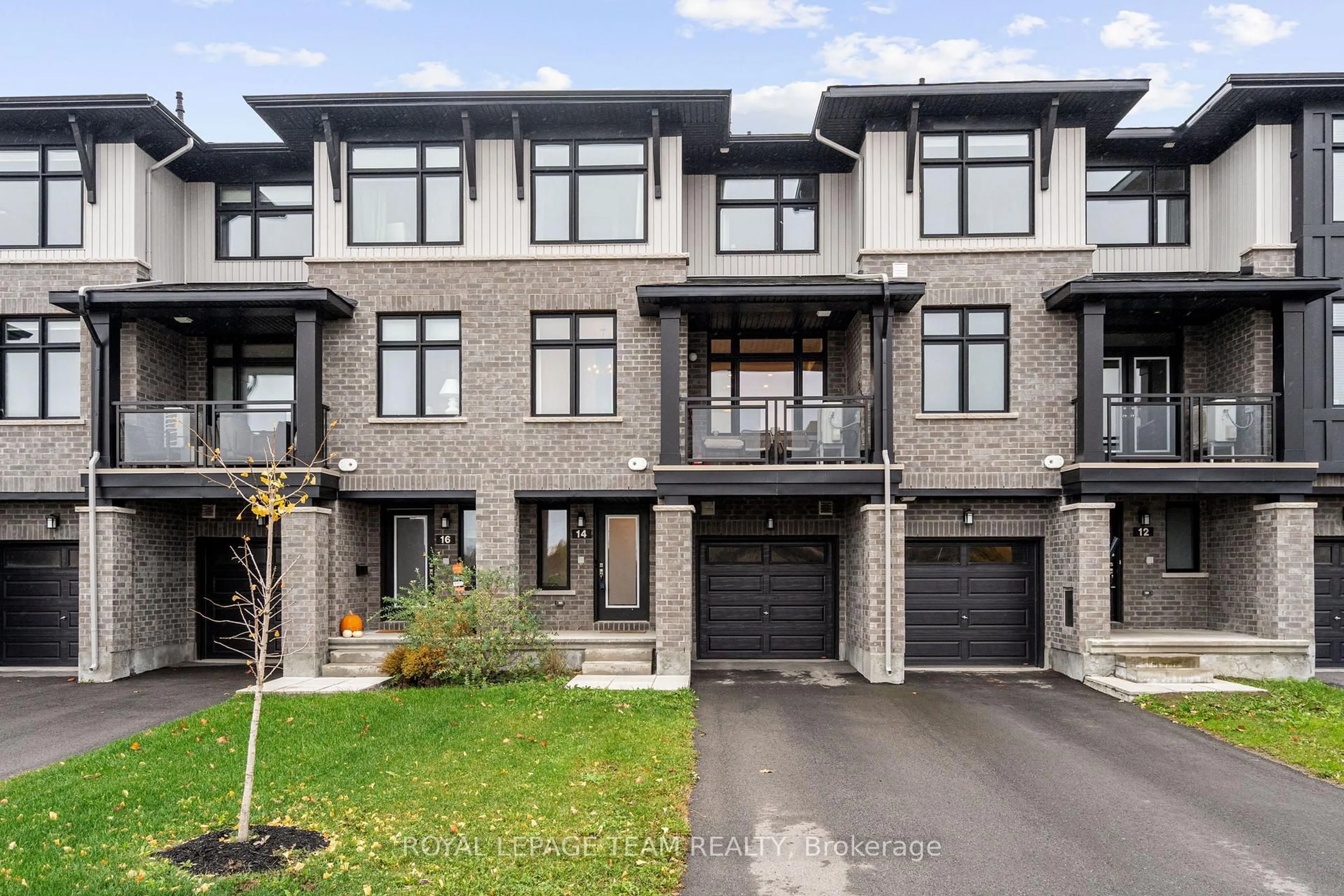 Home with brick exterior material, street for 14 Verglas Lane, Ottawa Ontario K1W 0P5