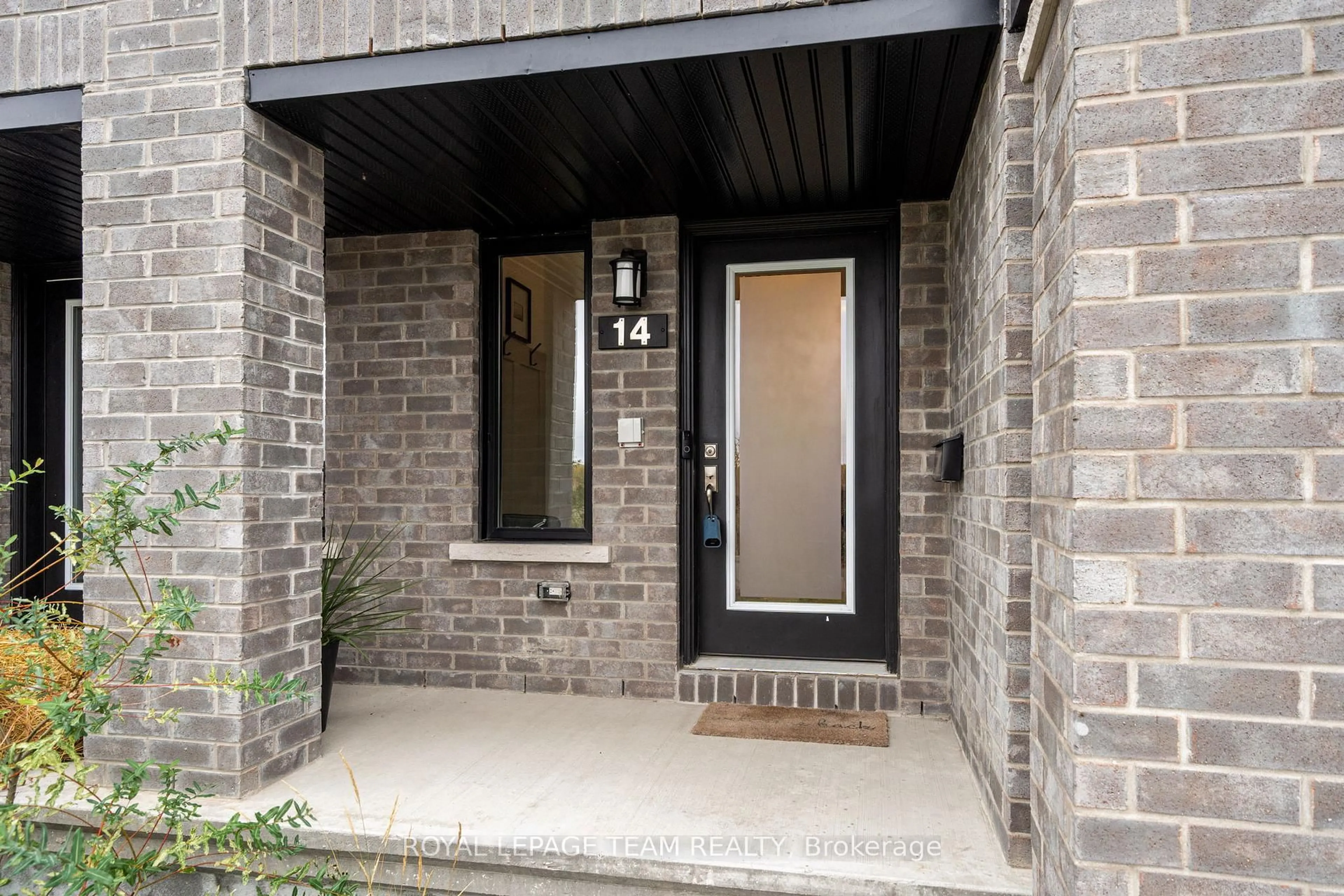 Home with brick exterior material, street for 14 Verglas Lane, Ottawa Ontario K1W 0P5