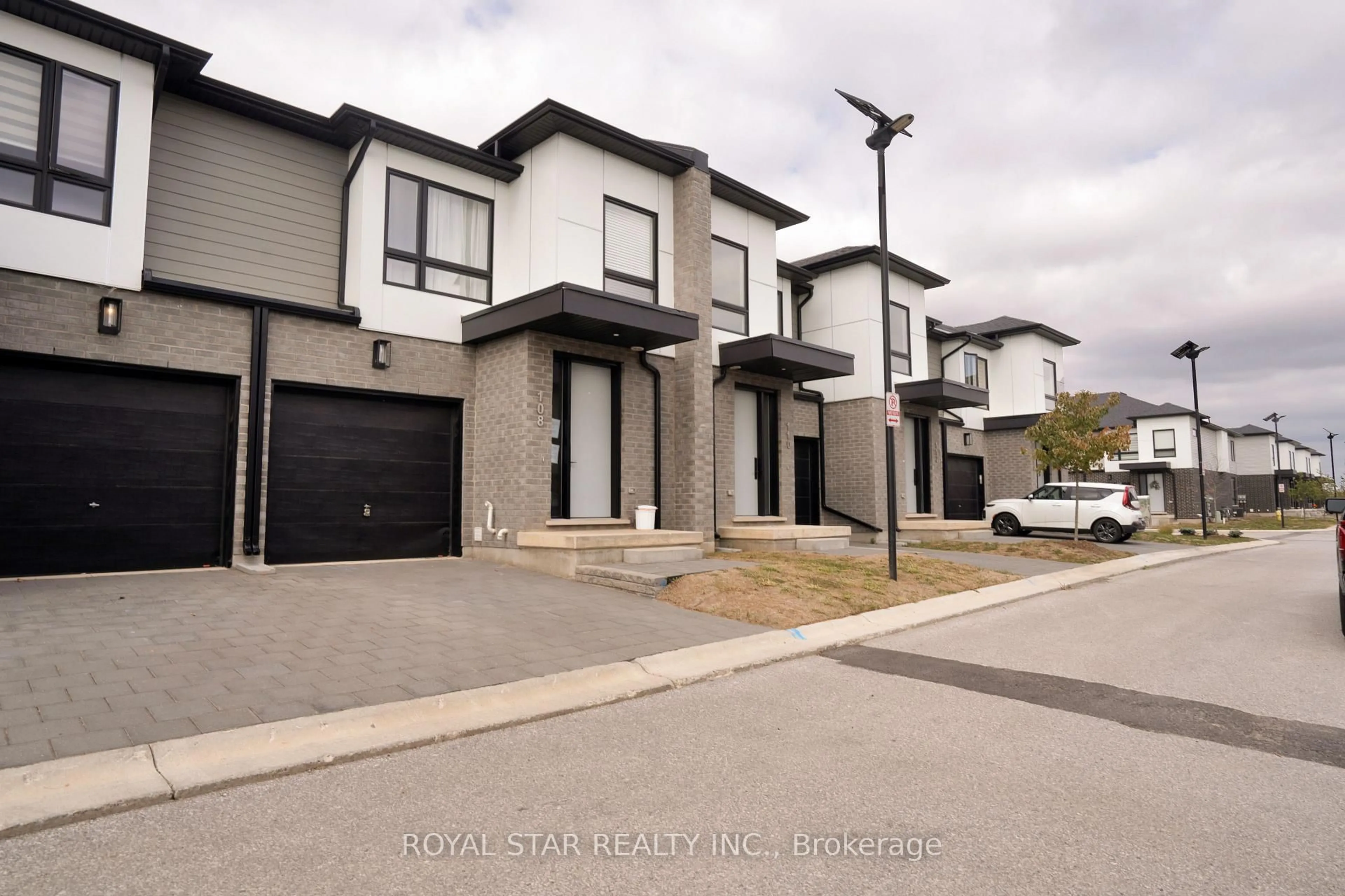 A pic from outside/outdoor area/front of a property/back of a property/a pic from drone, street for 175 Doan Dr #108, Middlesex Centre Ontario N0L 1R0