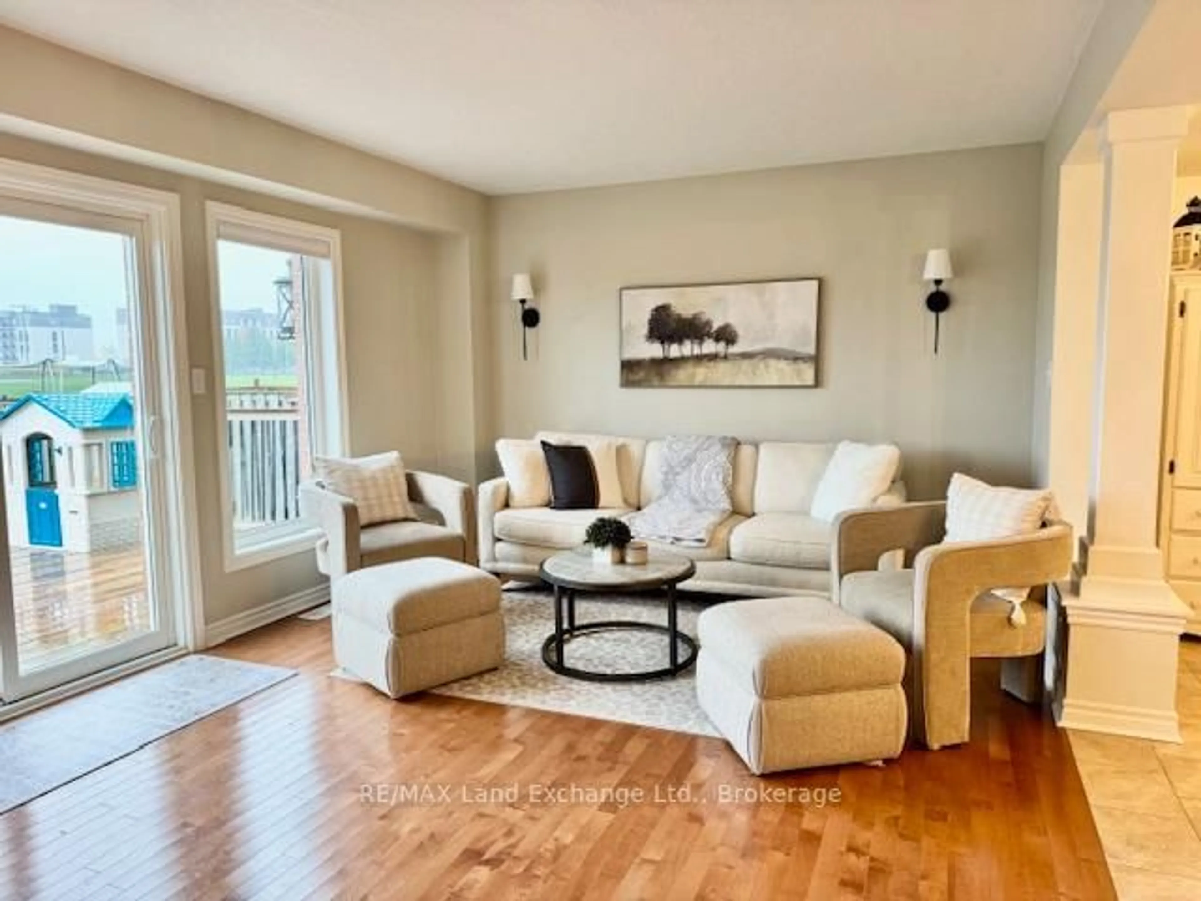 Living room with furniture, wood/laminate floor for 451 Joseph St, Saugeen Shores Ontario N0H 2C2