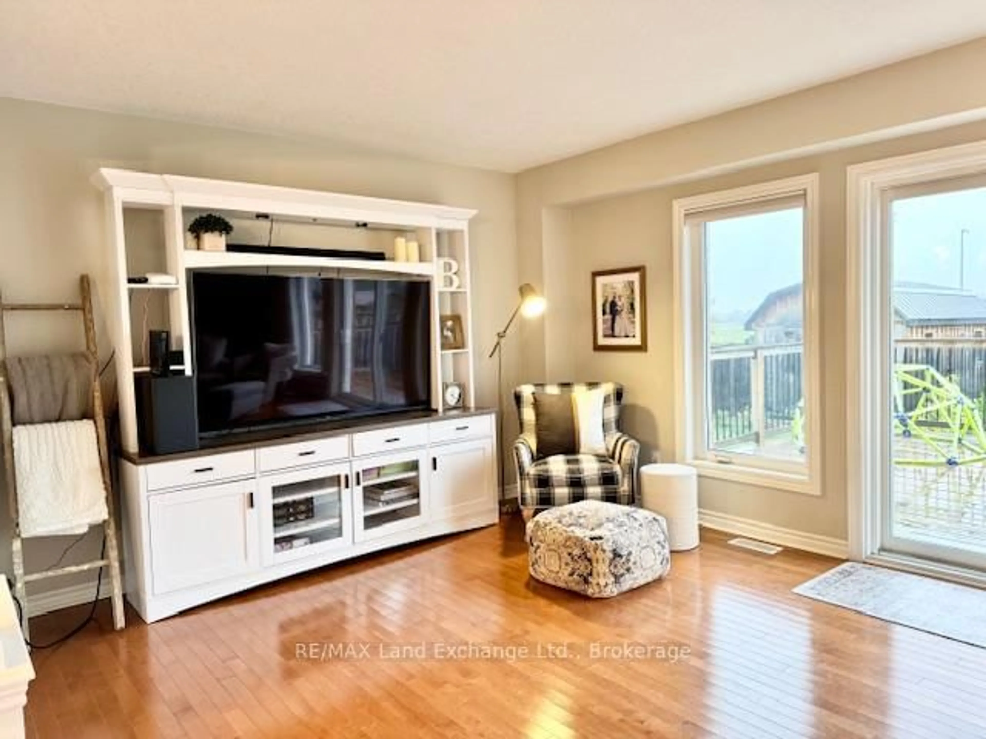 Living room with furniture, wood/laminate floor for 451 Joseph St, Saugeen Shores Ontario N0H 2C2